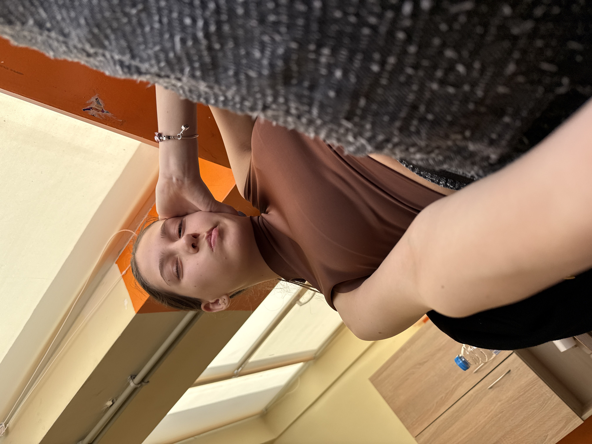 Woman observed in institutional building interior in Sofia