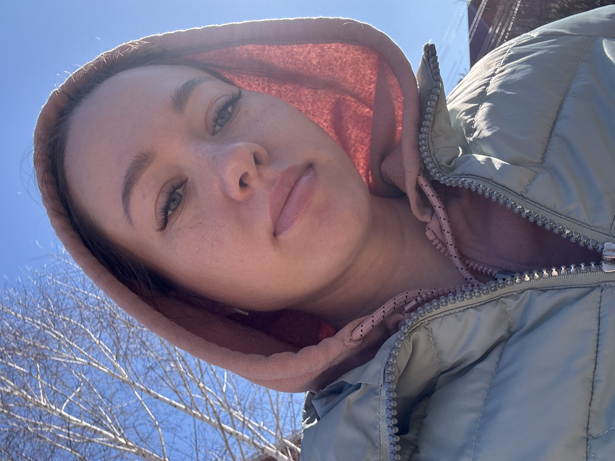 Mother and toddler take morning walk in rural Russian village