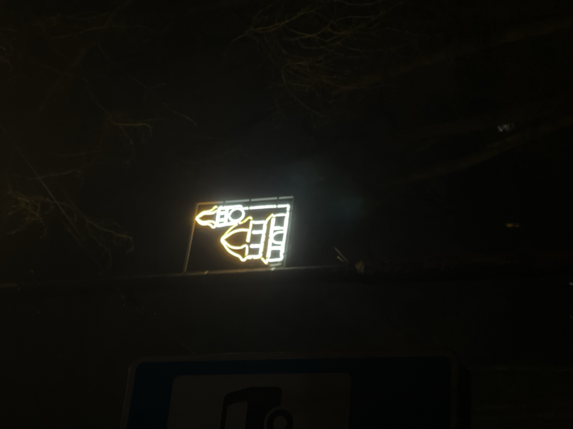 Hotel neon sign glows in Svetlogorsk evening