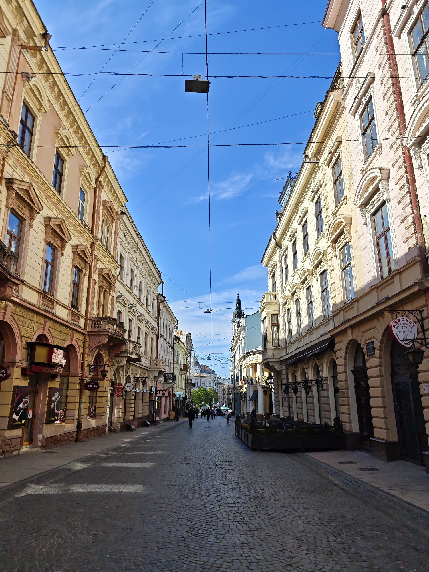 Afternoon stroll documented through historic Chernivtsi streets and architecture
