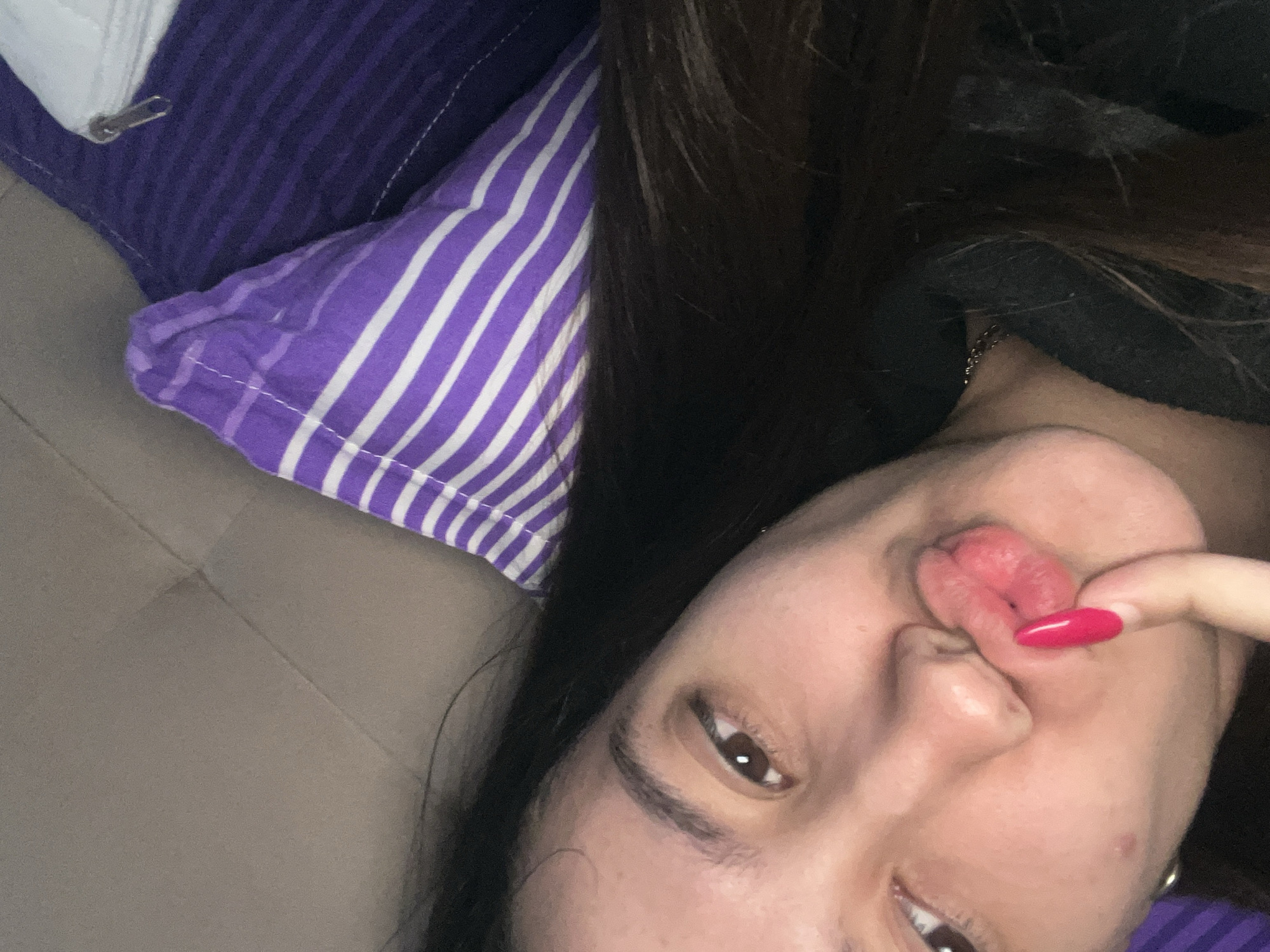 Woman takes morning selfies in bedroom in Varna