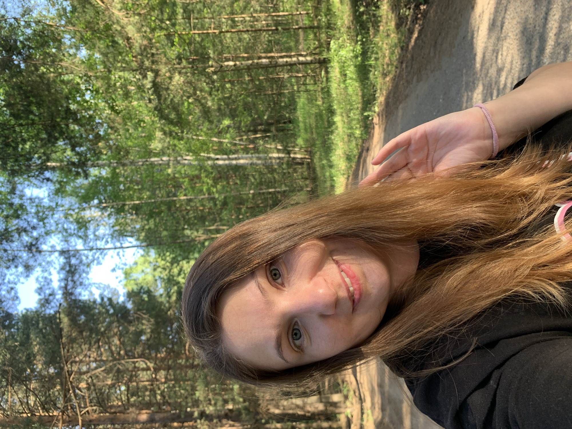 Woman enjoys afternoon picnic and forest walk in Chaikovsky