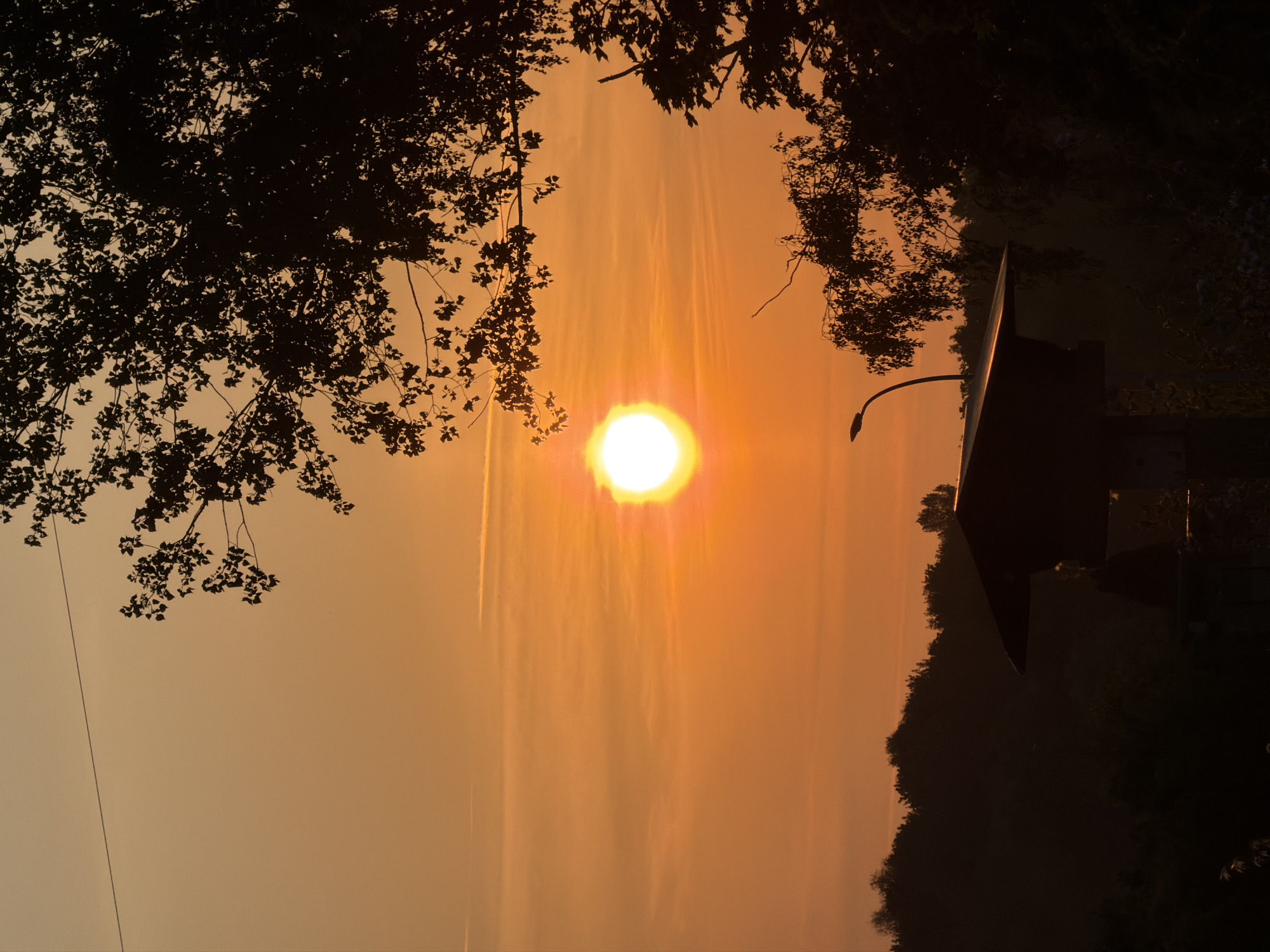 Warm sunset over the silhouetted skyline of Esch-sur-Alzette