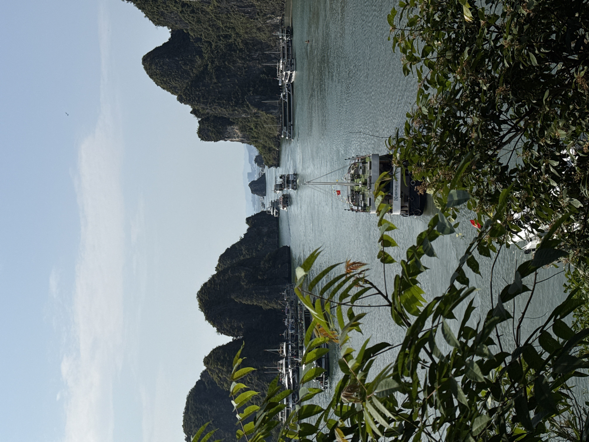 Tourists document Ha Long Bay scenery and cave formations