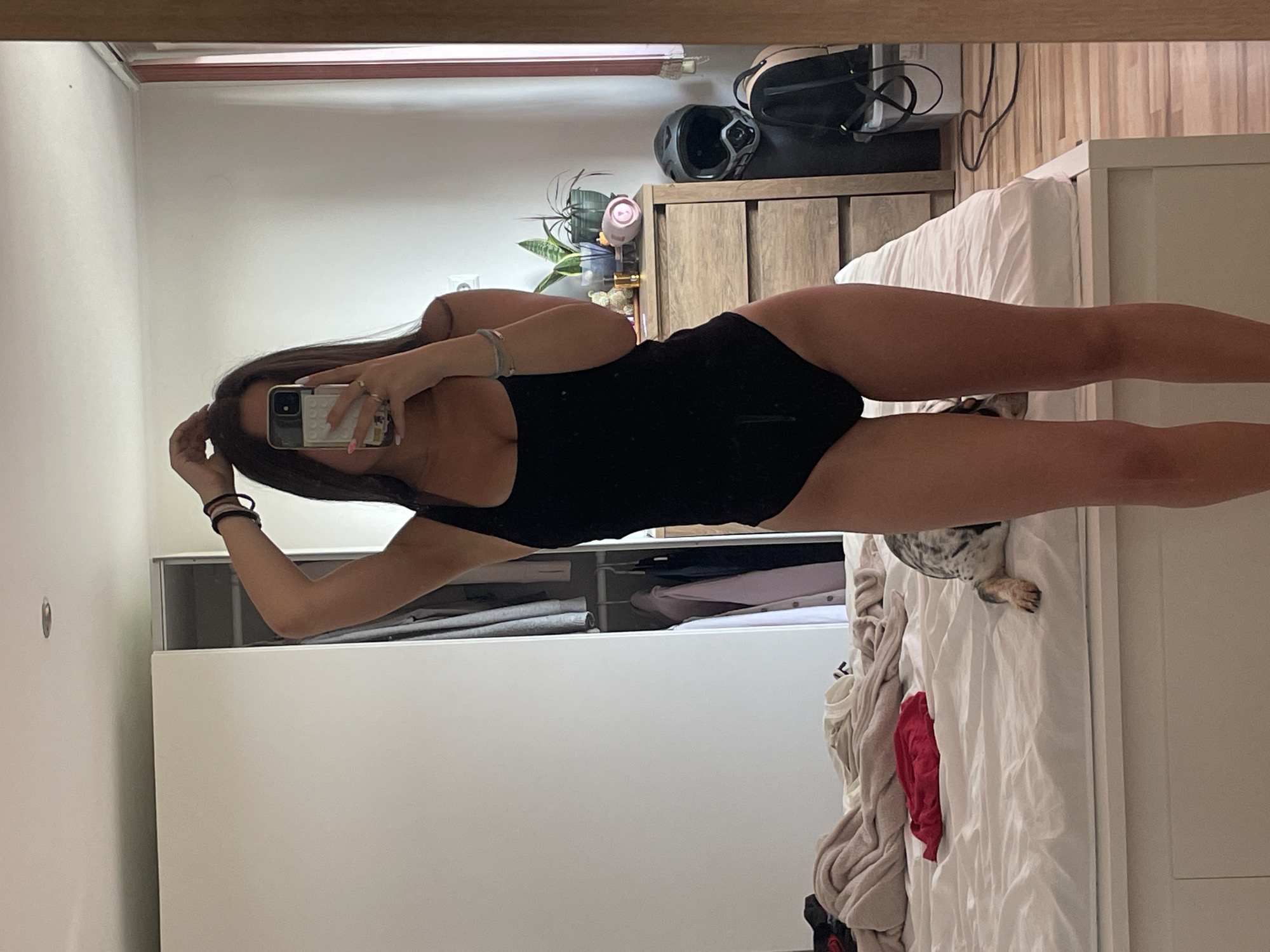 Woman takes morning mirror selfies in Varna bedroom