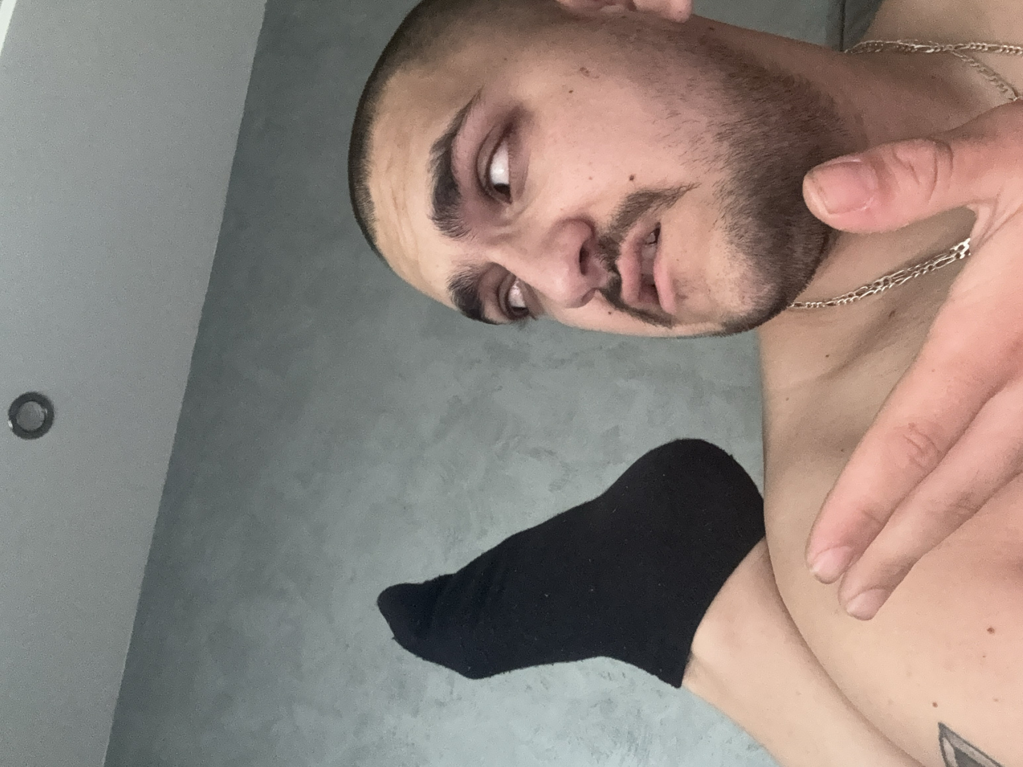 Men take selfies indoors in Pernik, Bulgaria