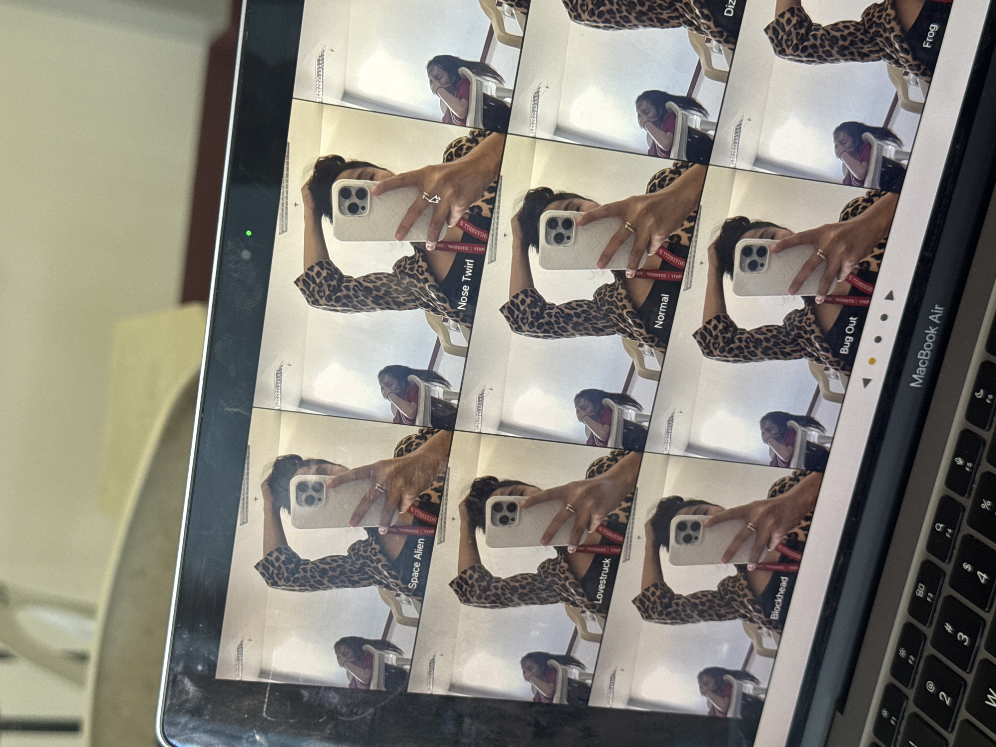 Person reviews filtered selfies on MacBook in Davao City
