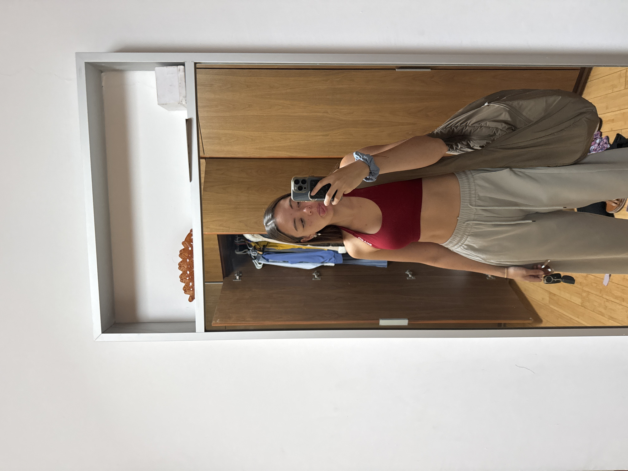 Woman takes mirror selfie in athletic wear in Mexico