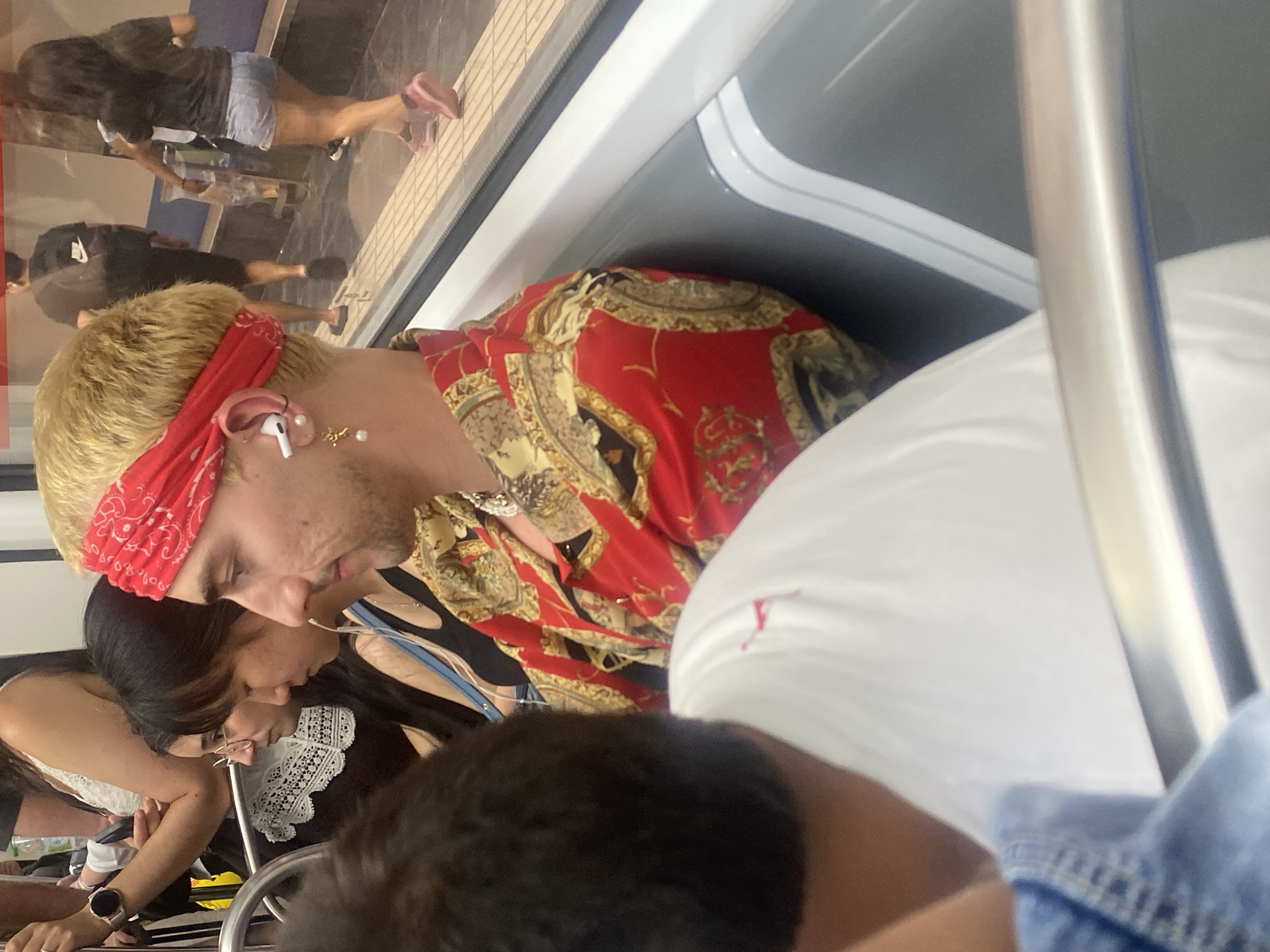 Blonde passenger on public transit in L'Hospitalet de Llobregat