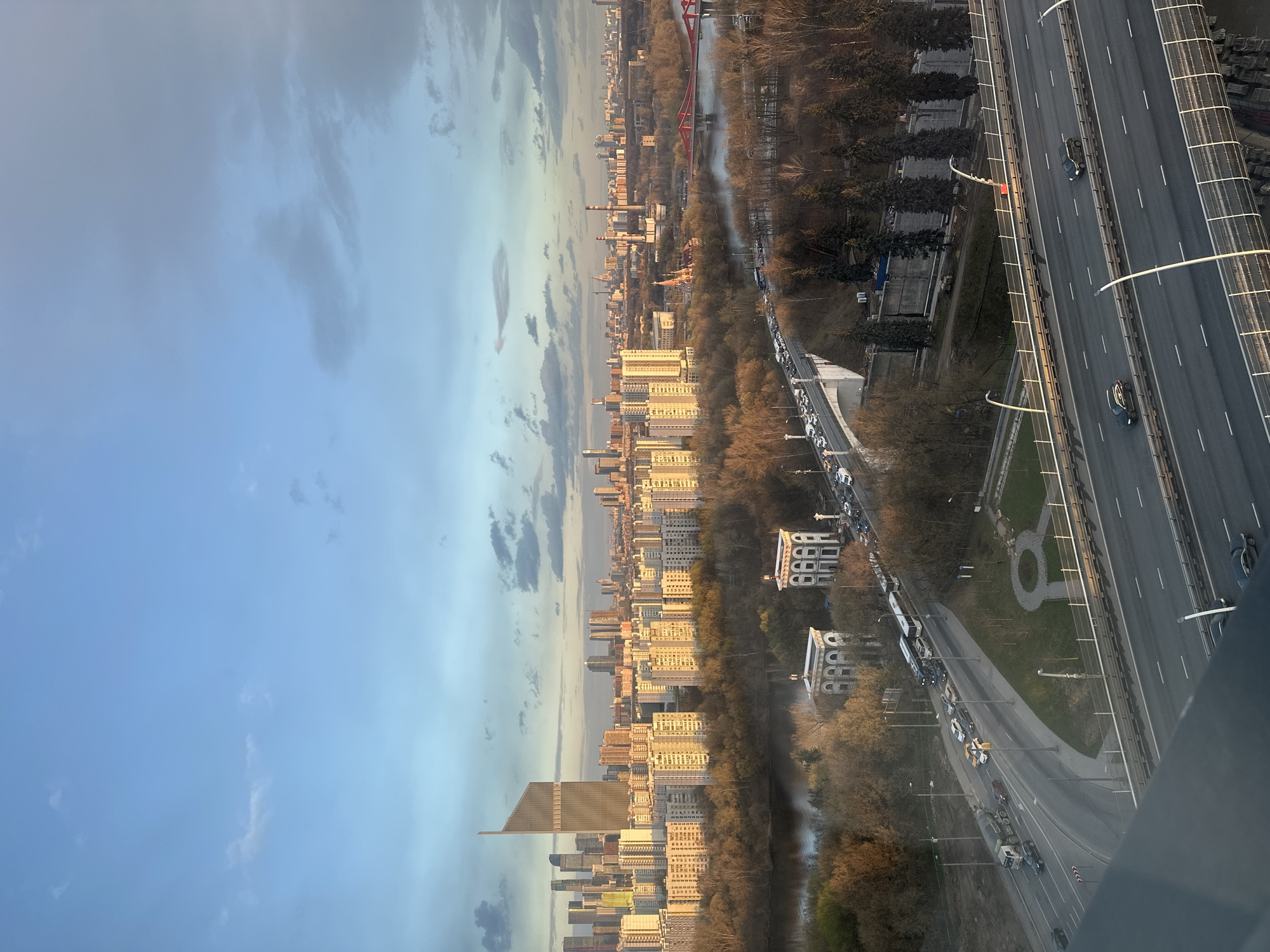Person documents cityscape views with smartphone in Khimki