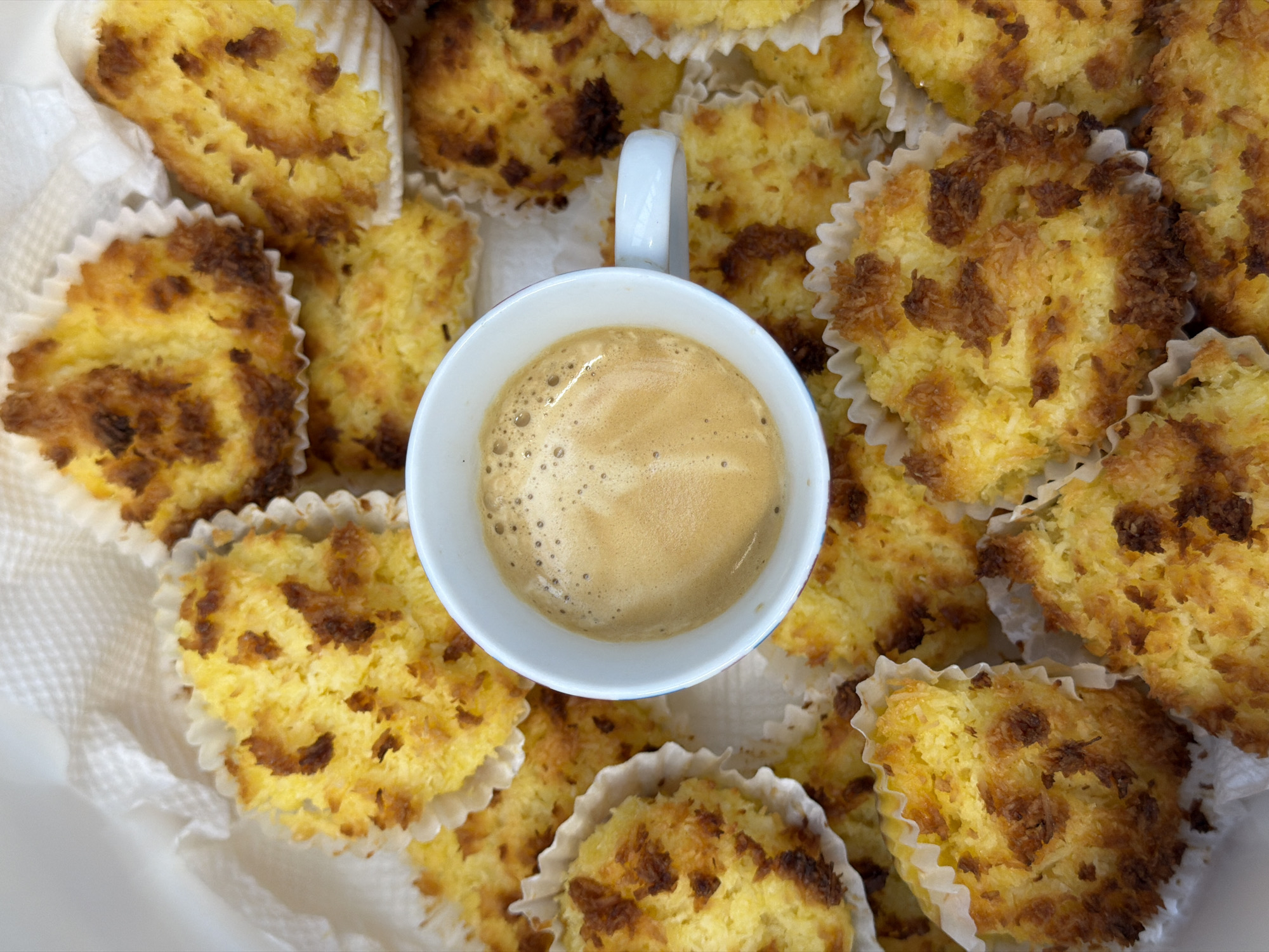 Morning coffee and coconut macaroons captured in Leudelange