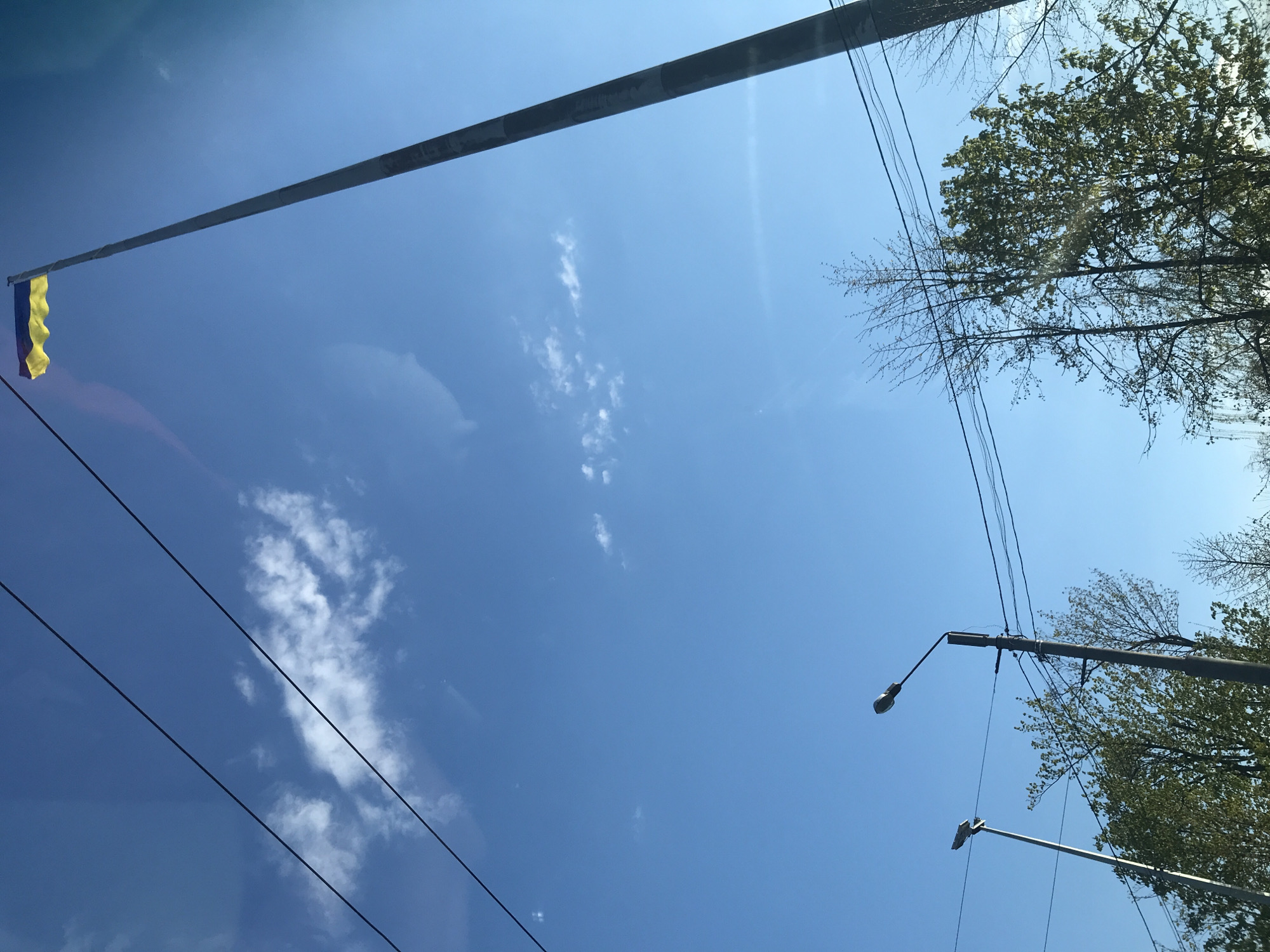 Spring day scenes captured in Kharkiv showing flag, streets