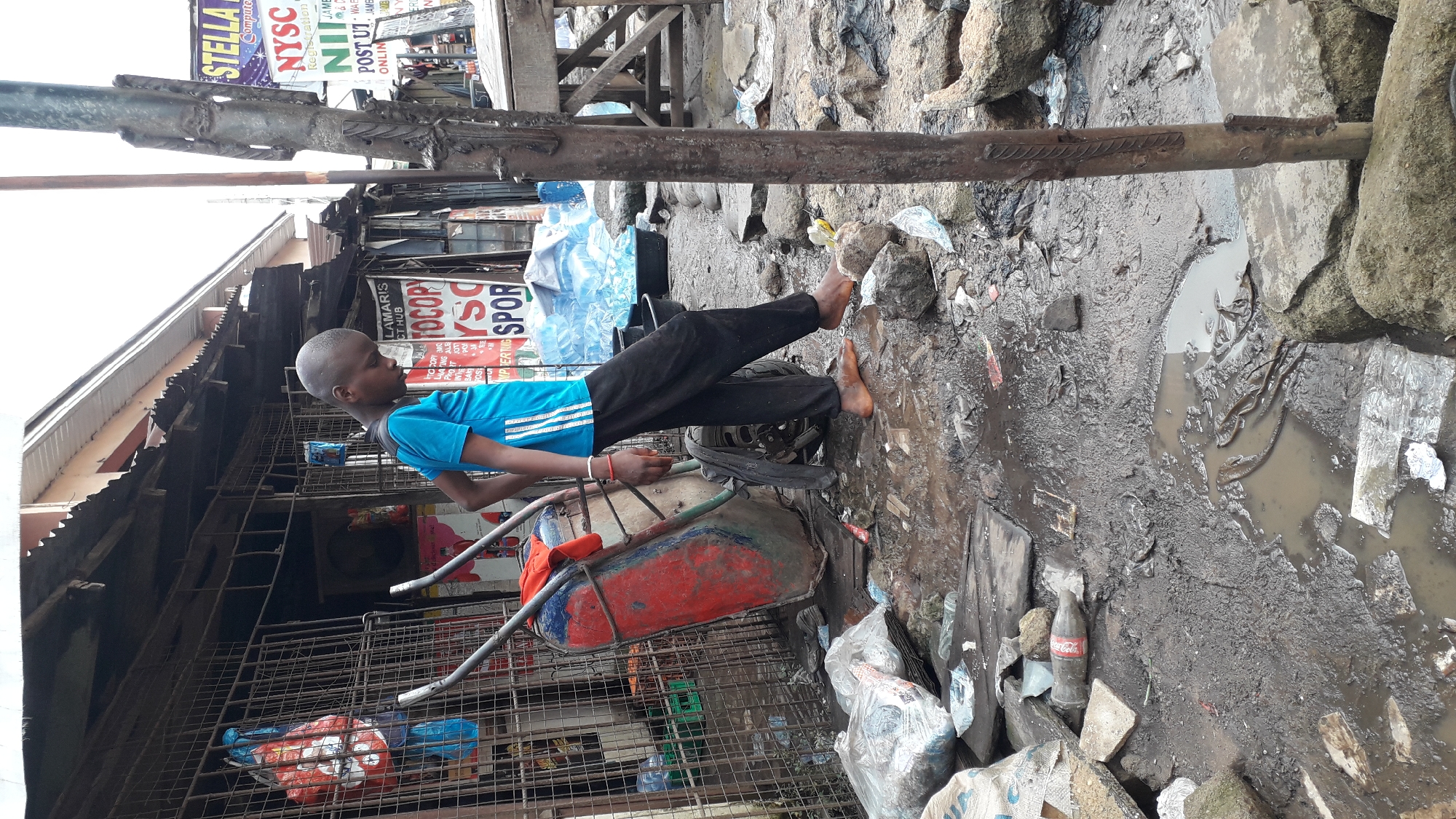 Afternoon street life in Onitsha's informal urban neighborhoods