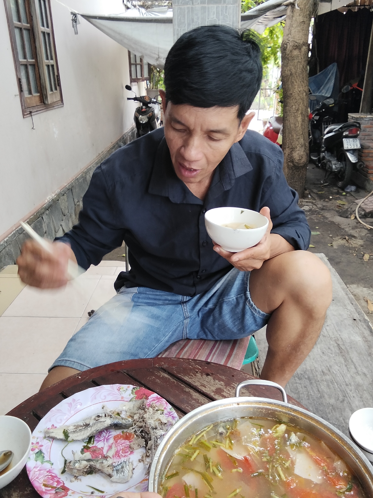 Bowl of soup at an outdoor table in Mũi Né