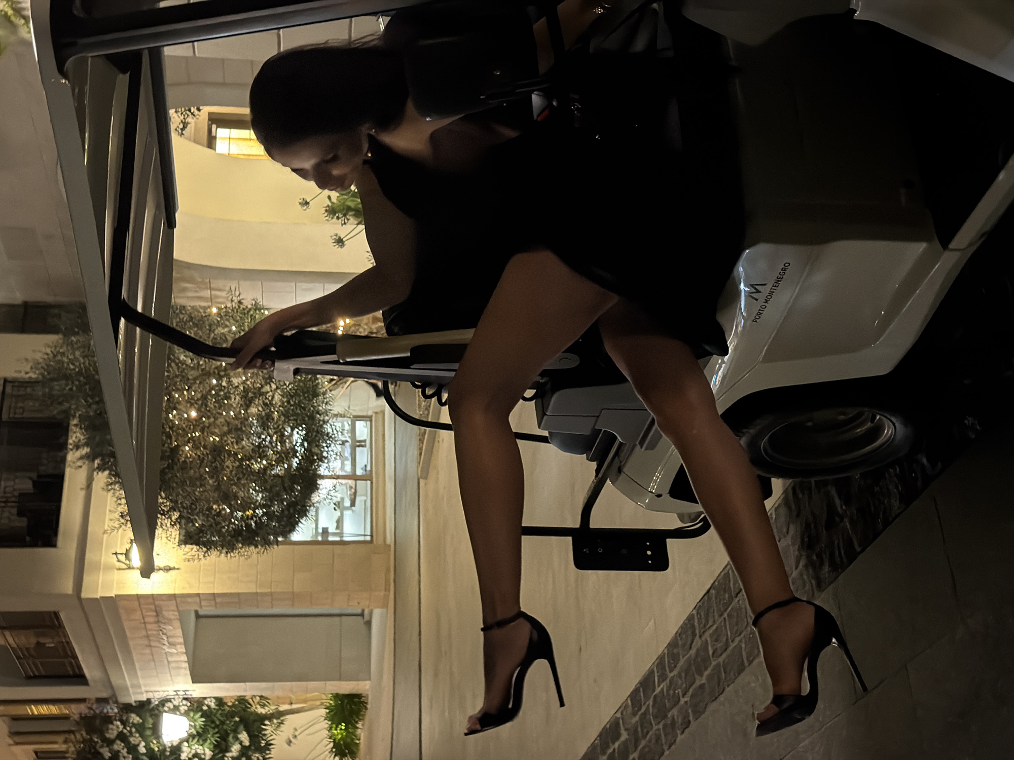 Late night at Porto Montenegro: a golf cart, heels, and a cat.