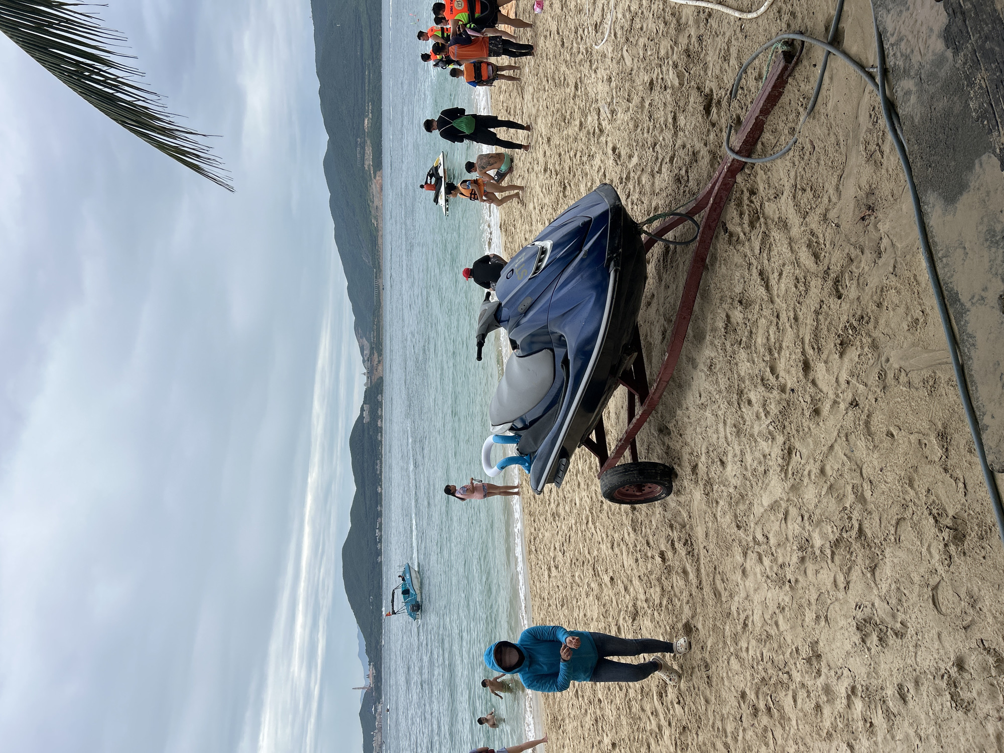 Watersports gear and action on a cloudy Nha Trang morning