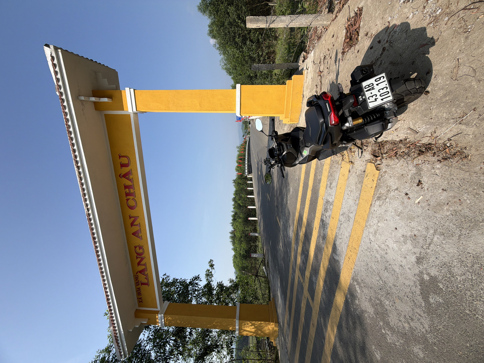 Motorcycle parked at An Châu village monument in Đà Nẵng