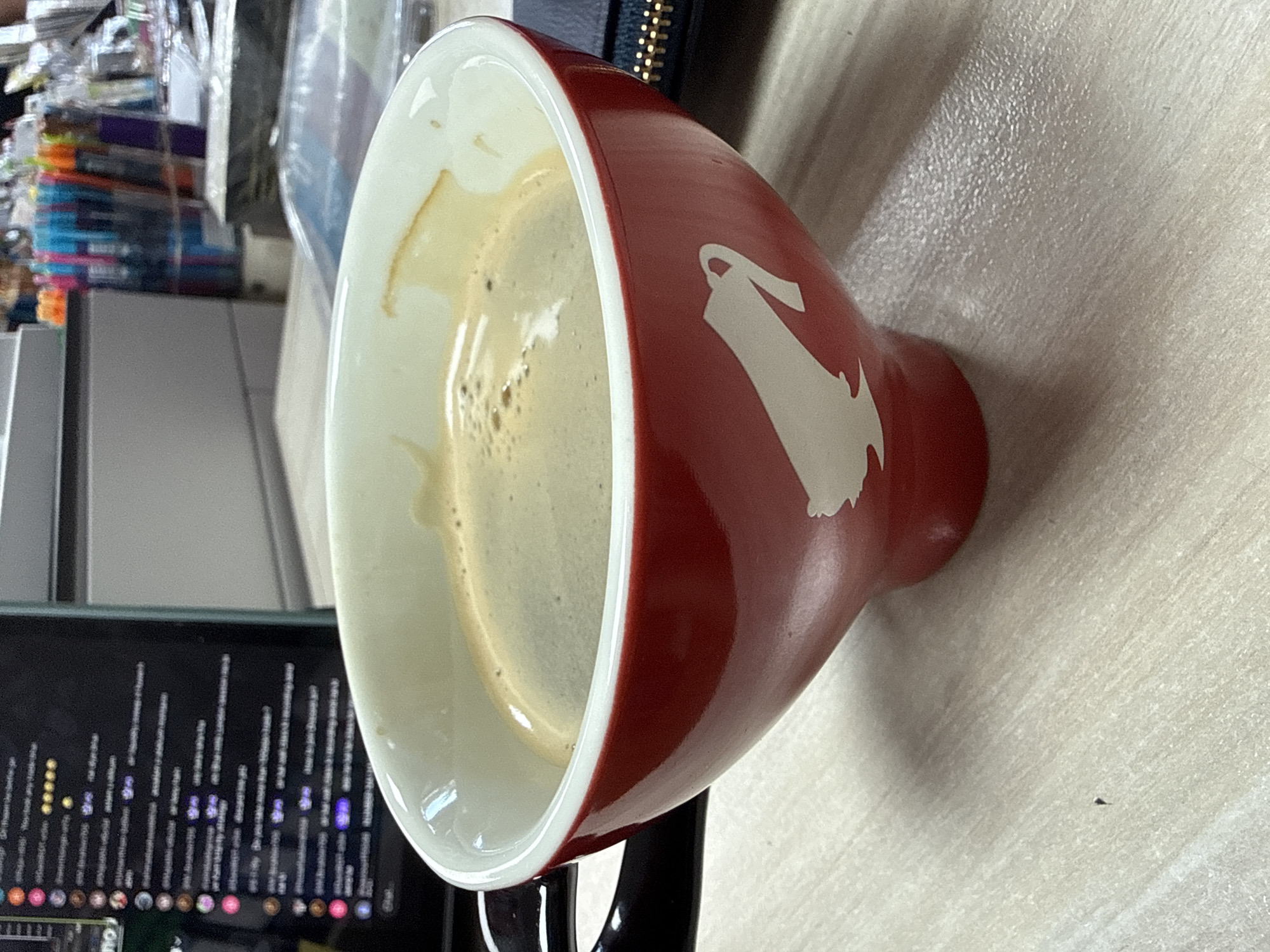 Red coffee mug on a textured surface, Aksakovo