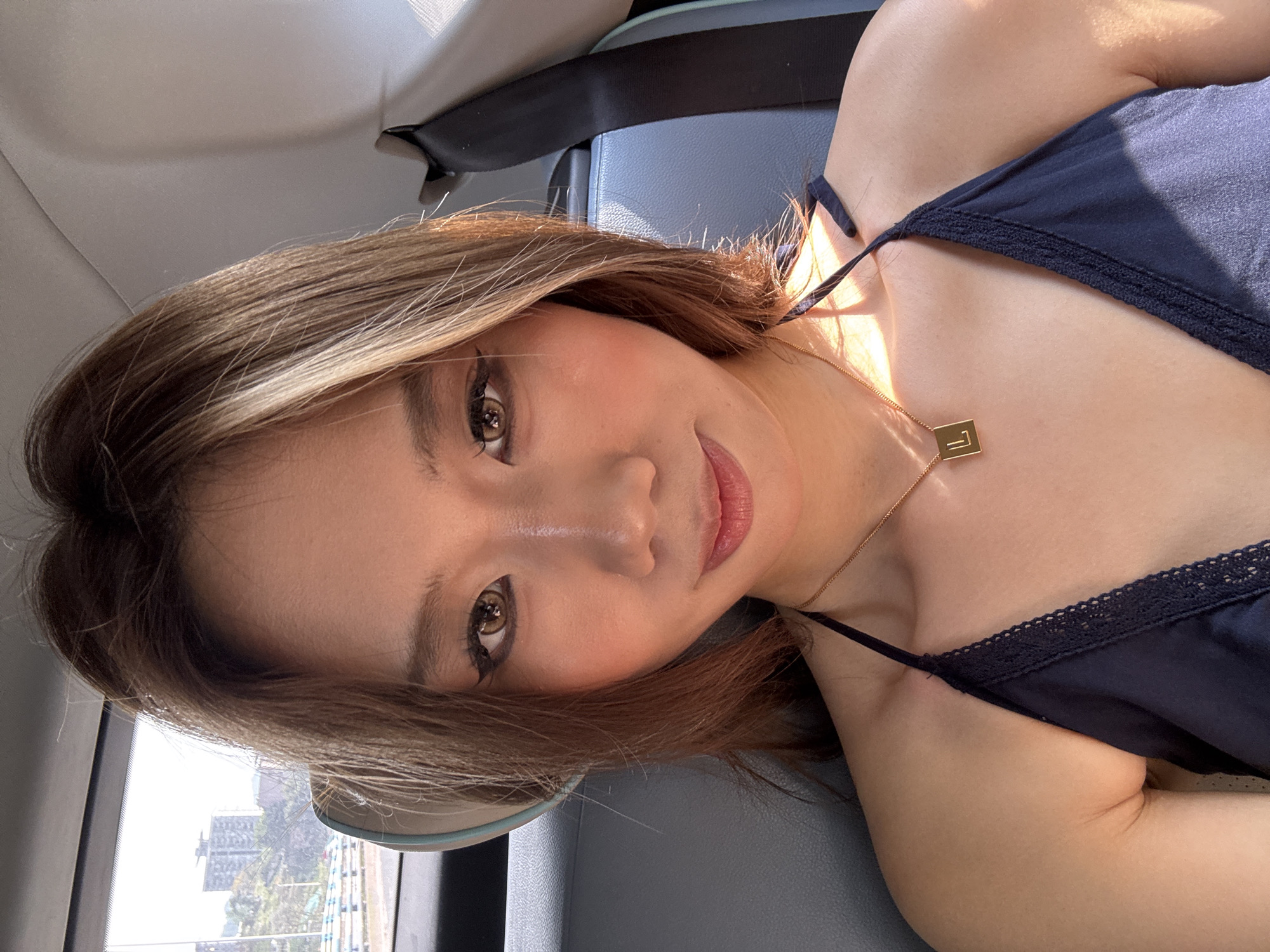 Woman takes selfie in car backseat in Nan'an District