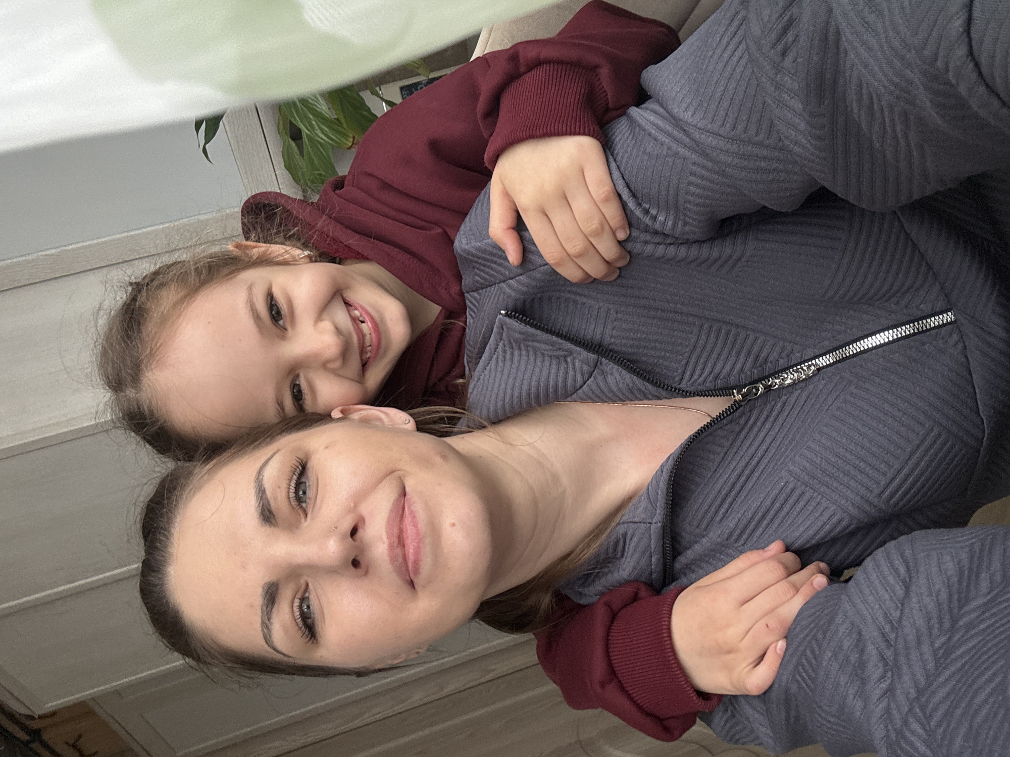 Mother and daughter photographed together in Razdolye home