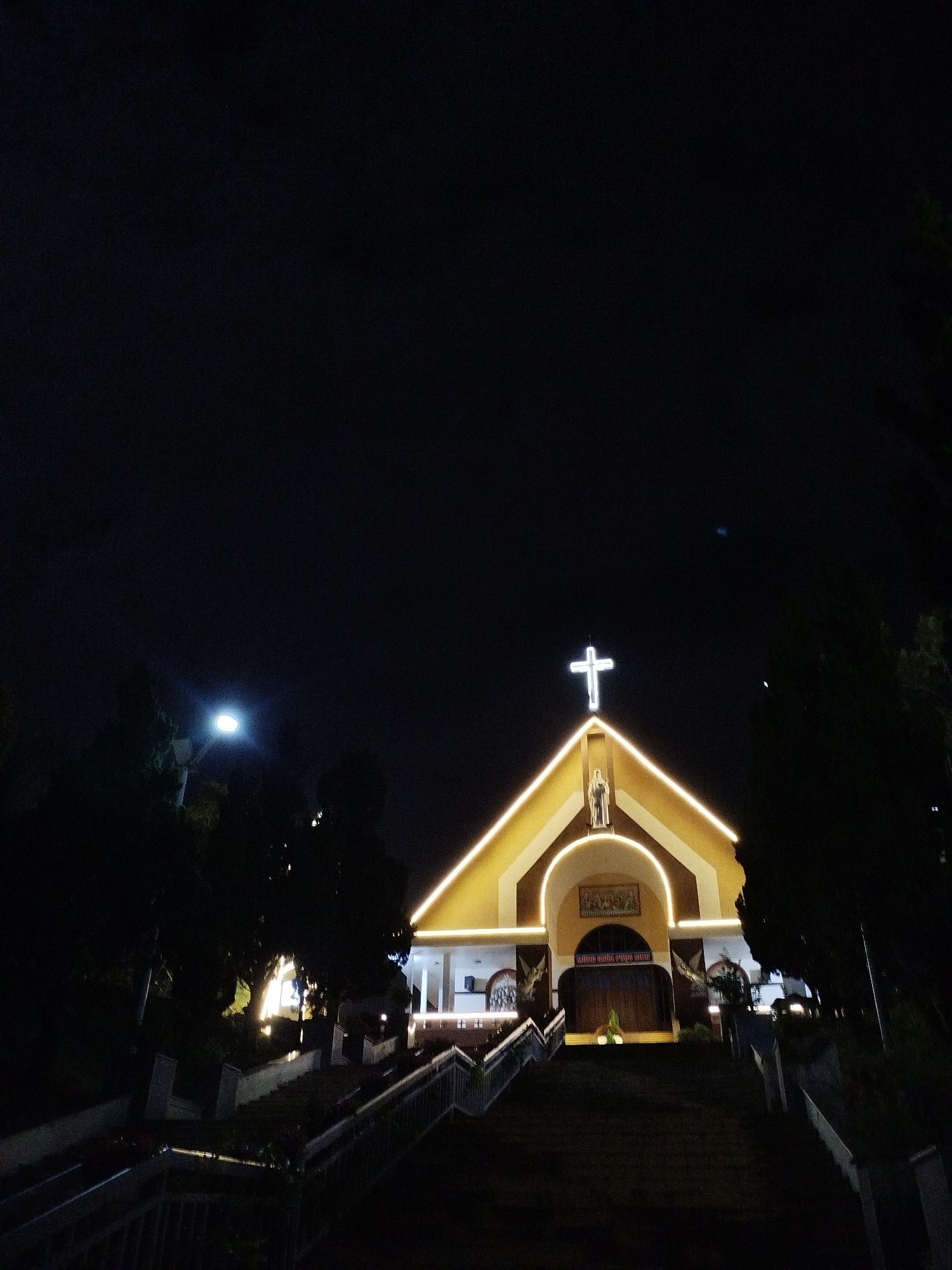 Illuminated church displays captured at night in Lạc Dương, Vietnam