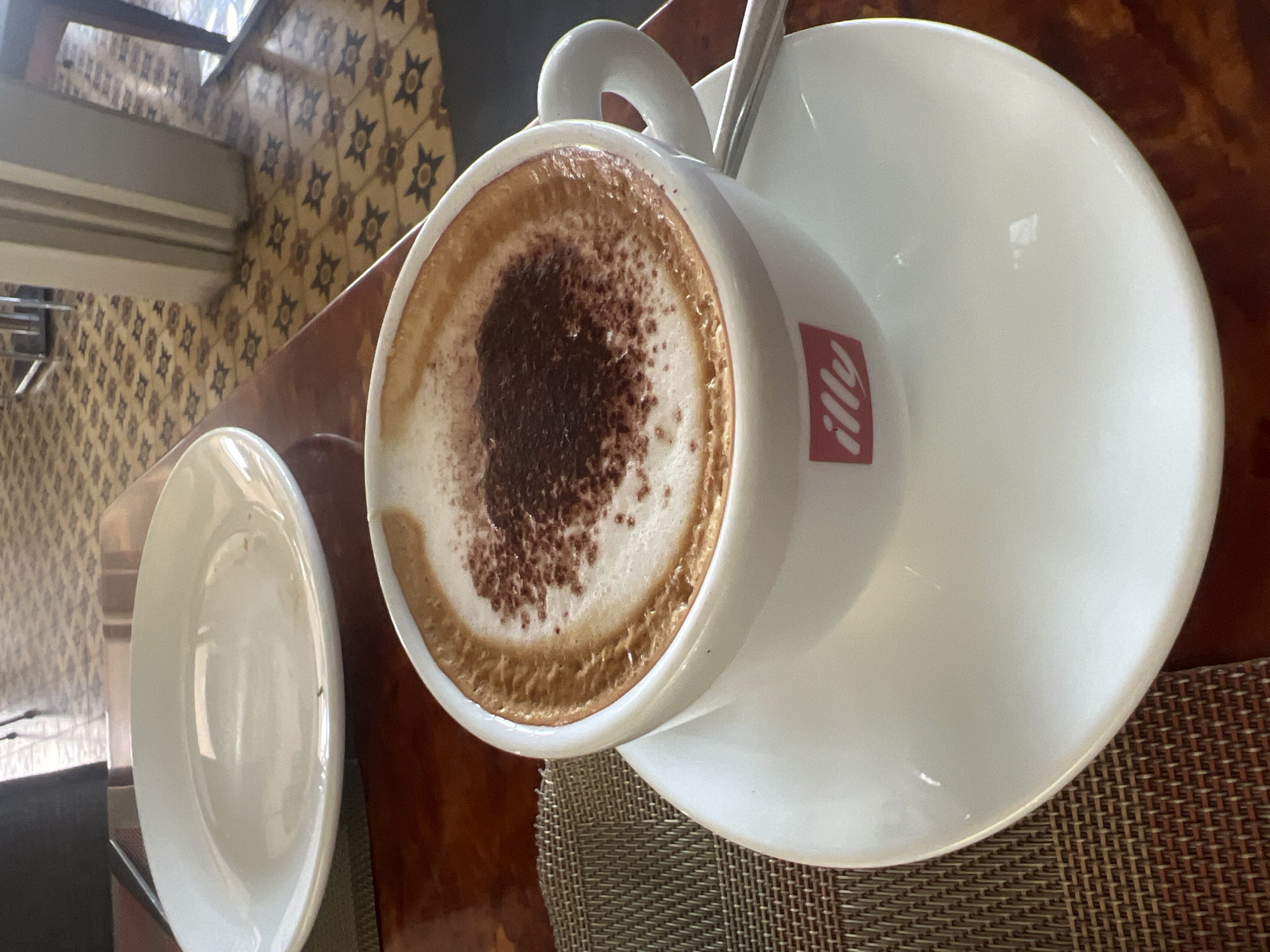 Tourist documents breakfast spread at Siem Reap restaurant