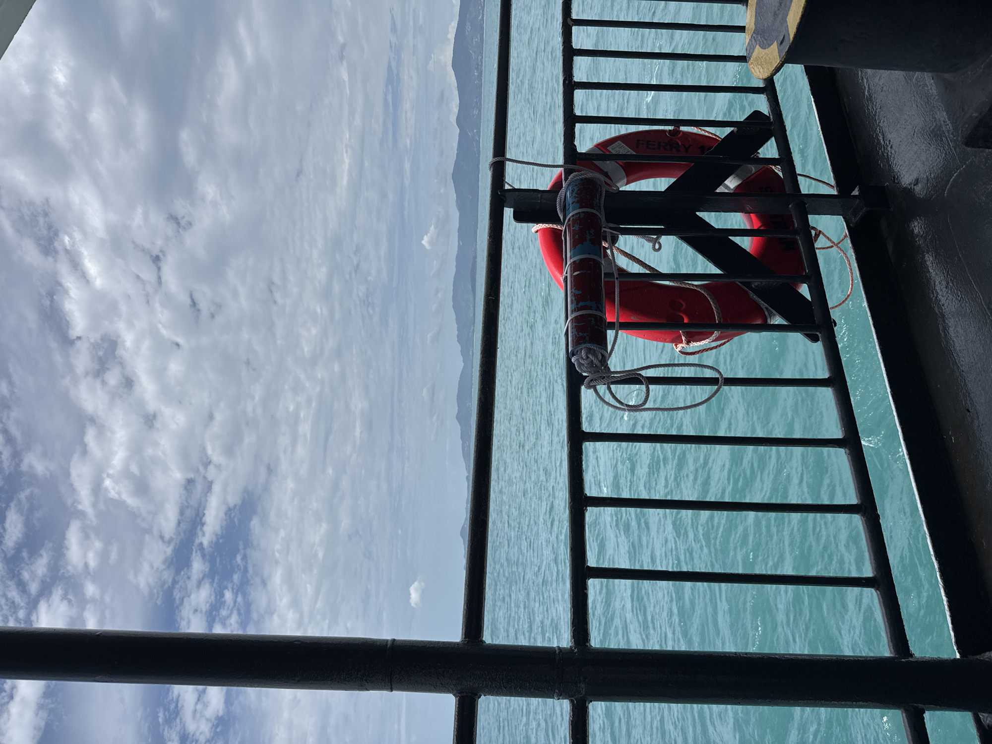 Ferry deck life preserver, calm turquoise waters off Ko Pha-ngan