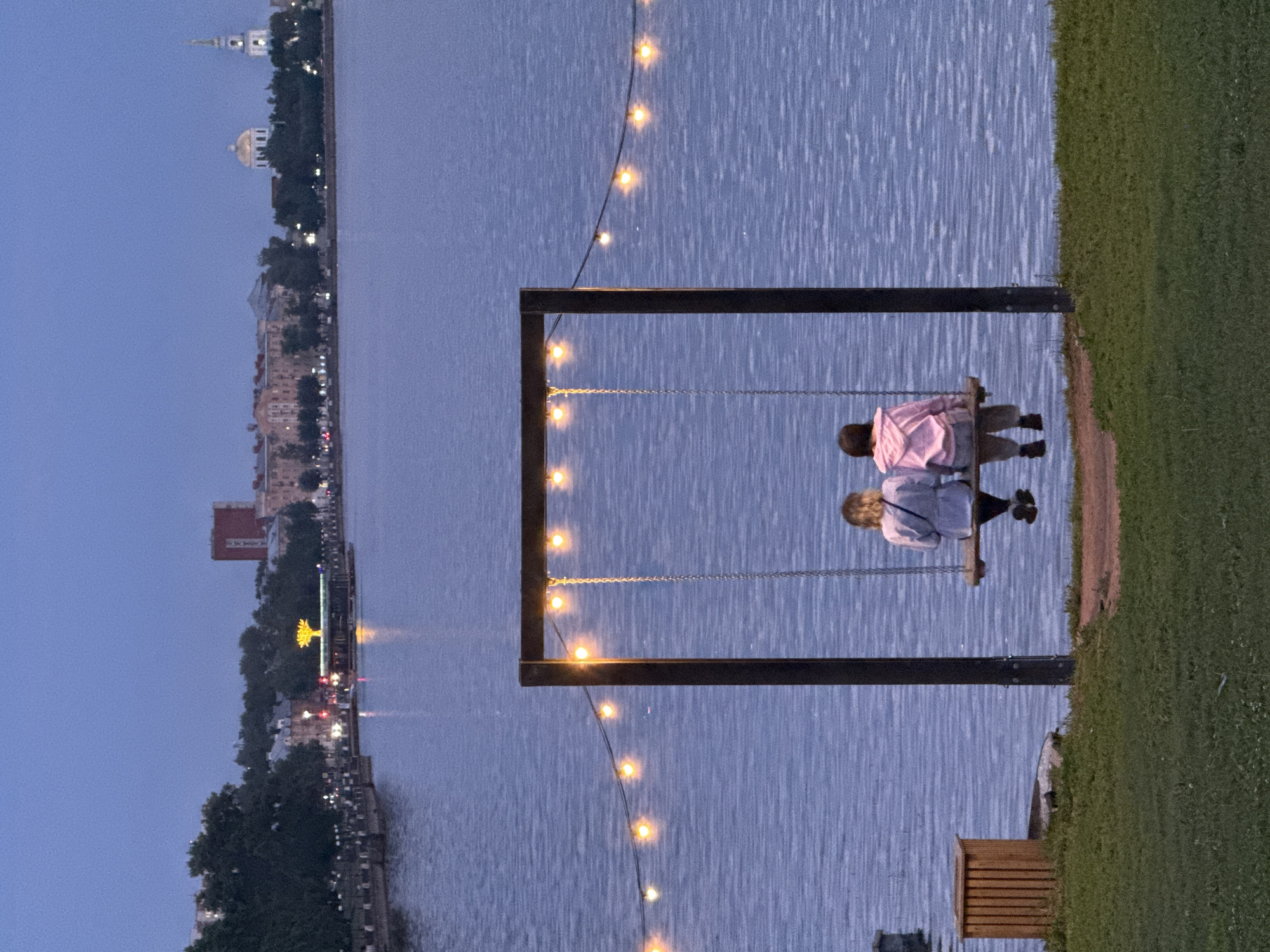 Evening at Votkinsk's waterfront: domes, docks, and a surf bar