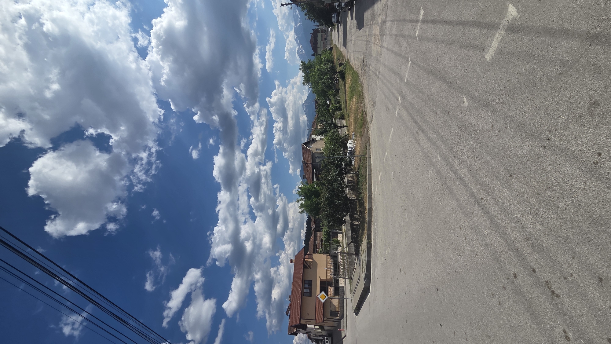 Streets, a stone church, and a stork's nest in Bania