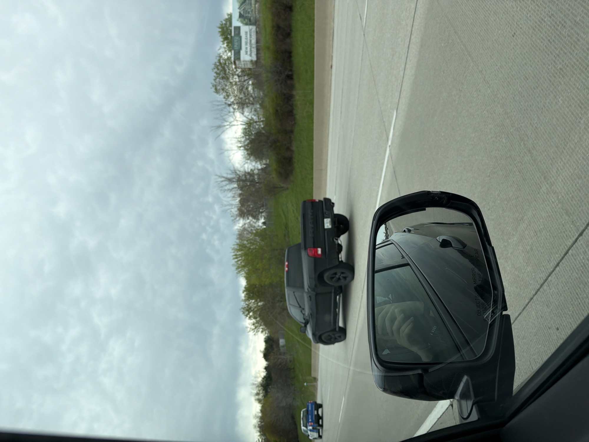 Highway traffic observed near Toronto featuring black pickup trucks