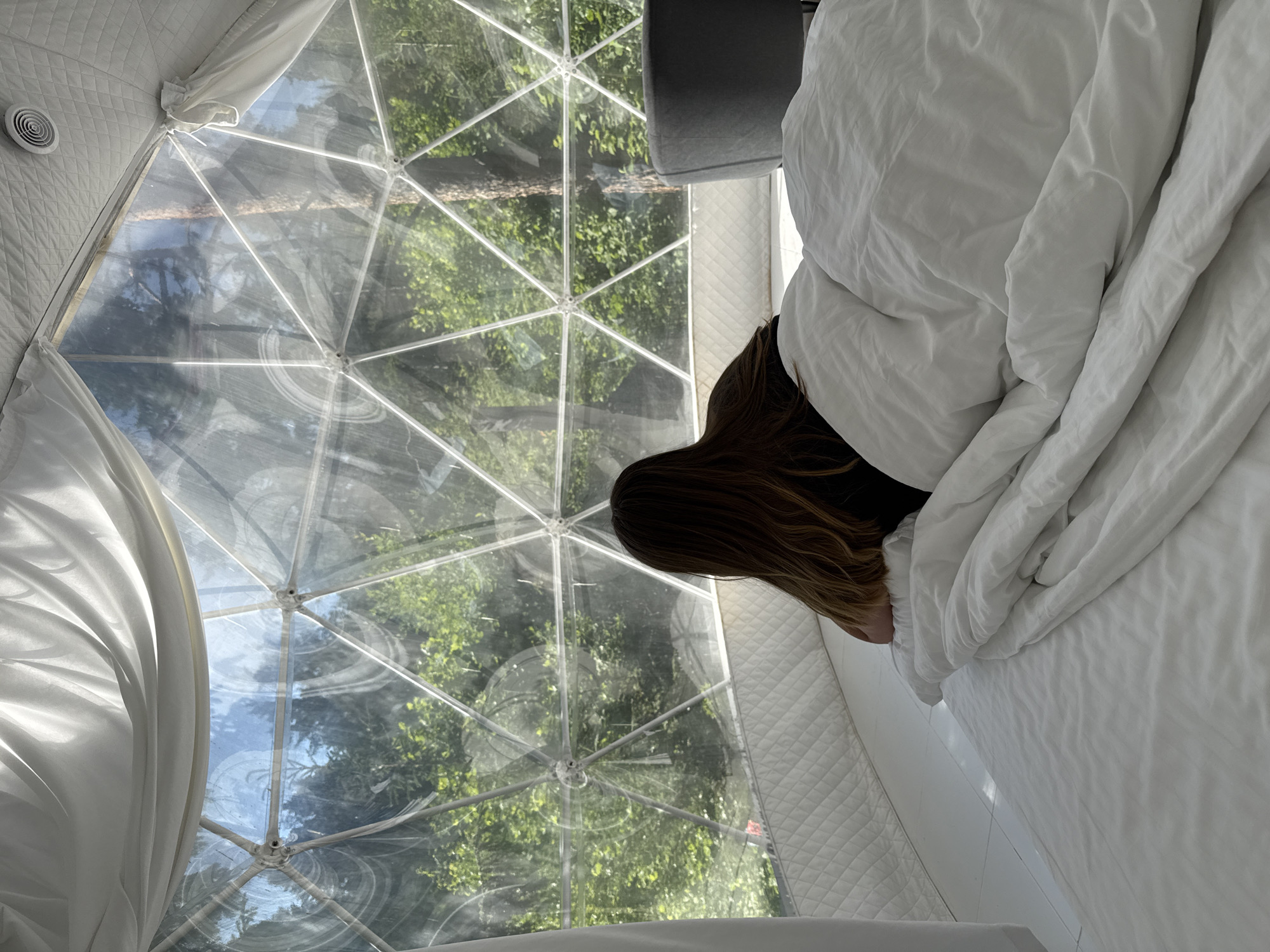 Woman enjoys glamping experience in geodesic dome, Nechkino Russia
