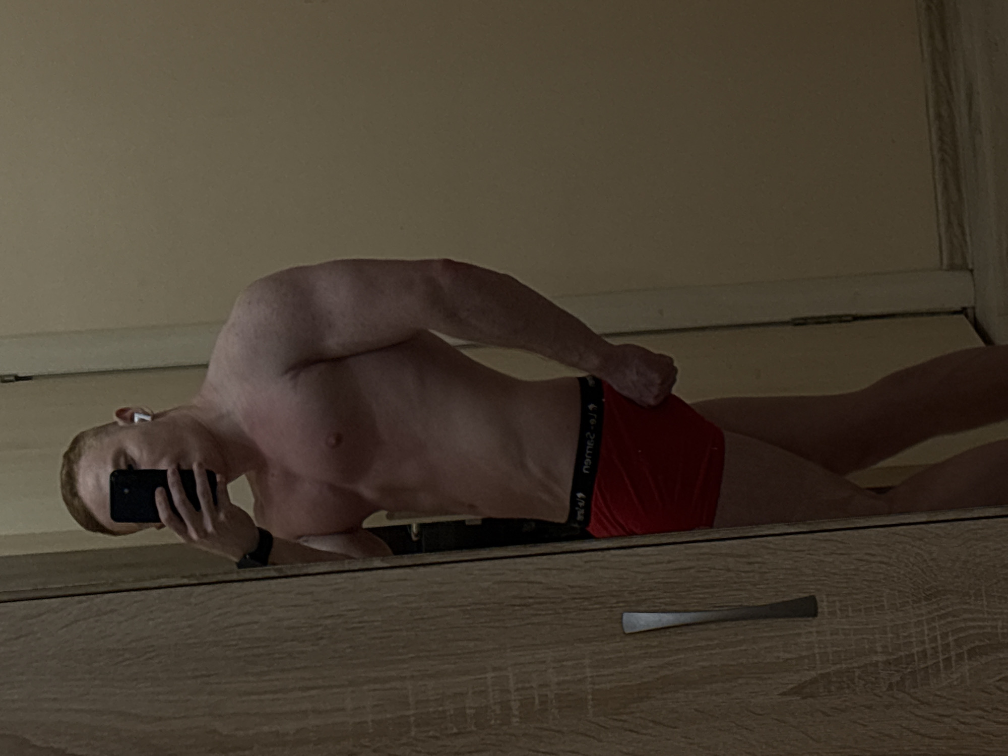 Man takes mirror selfies indoors in Chaikovsky, Russia