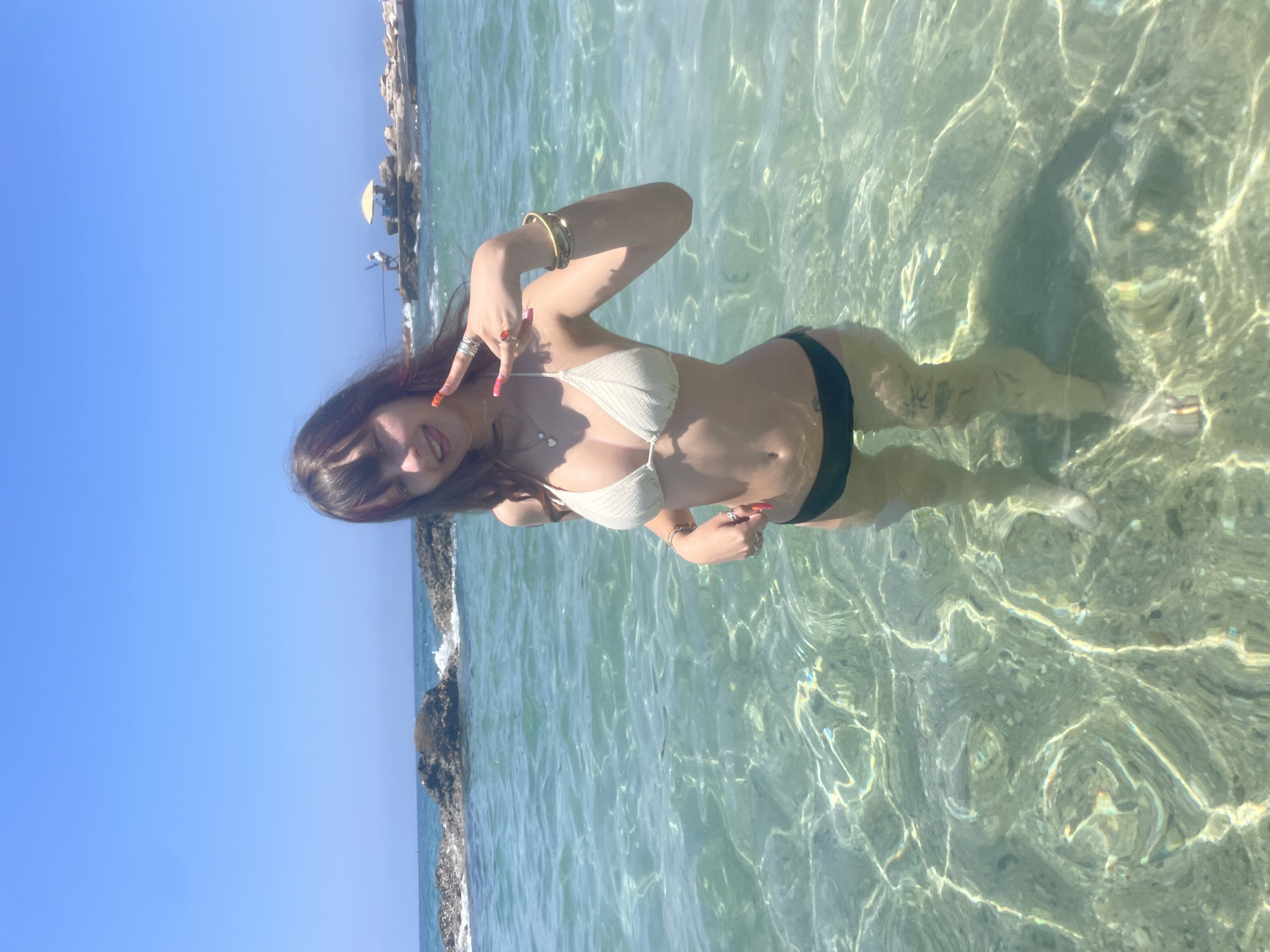 Wading in clear turquoise water off the Paphos coast