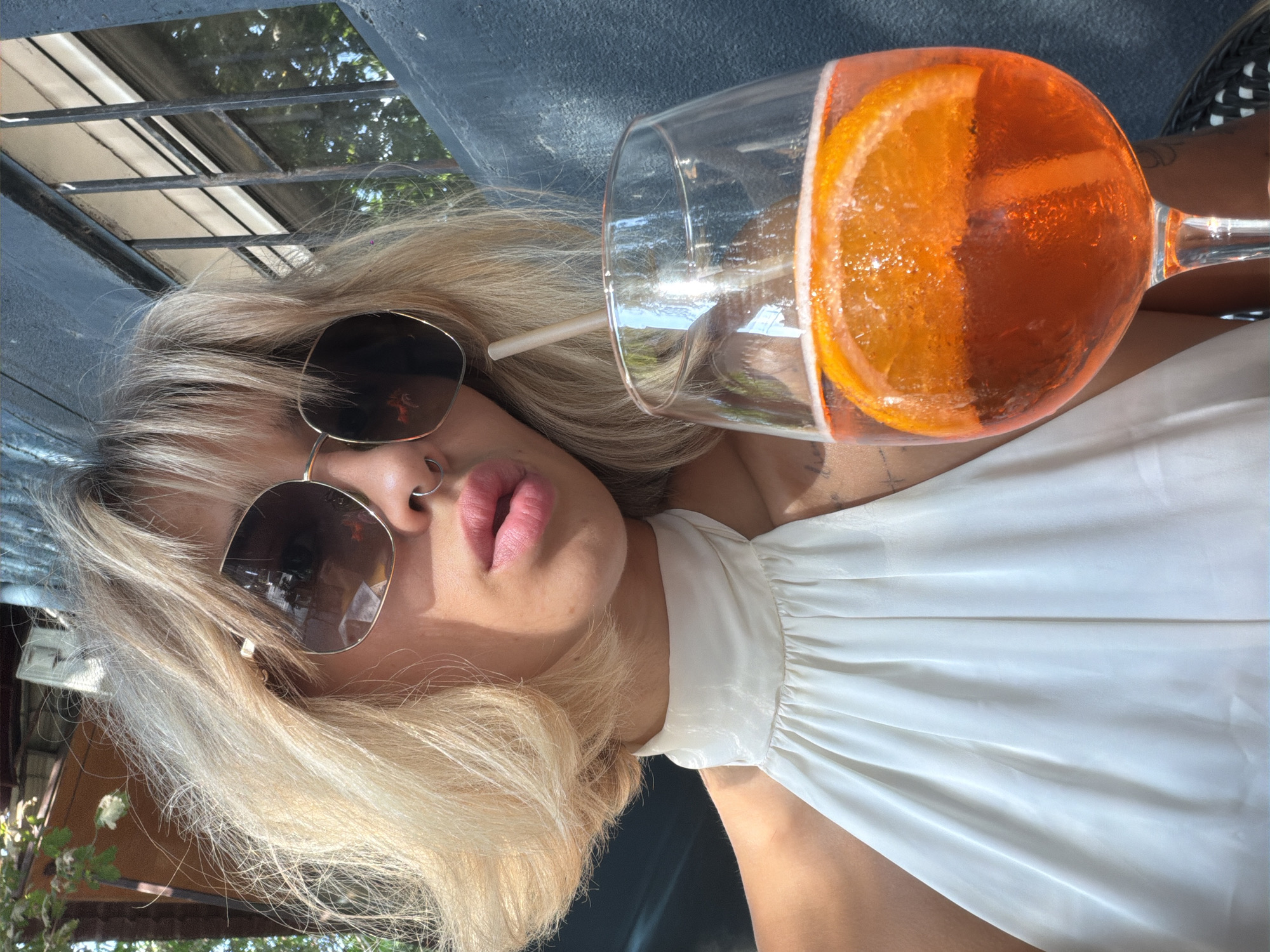 Drinks and selfies at a shaded outdoor spot in Yerevan