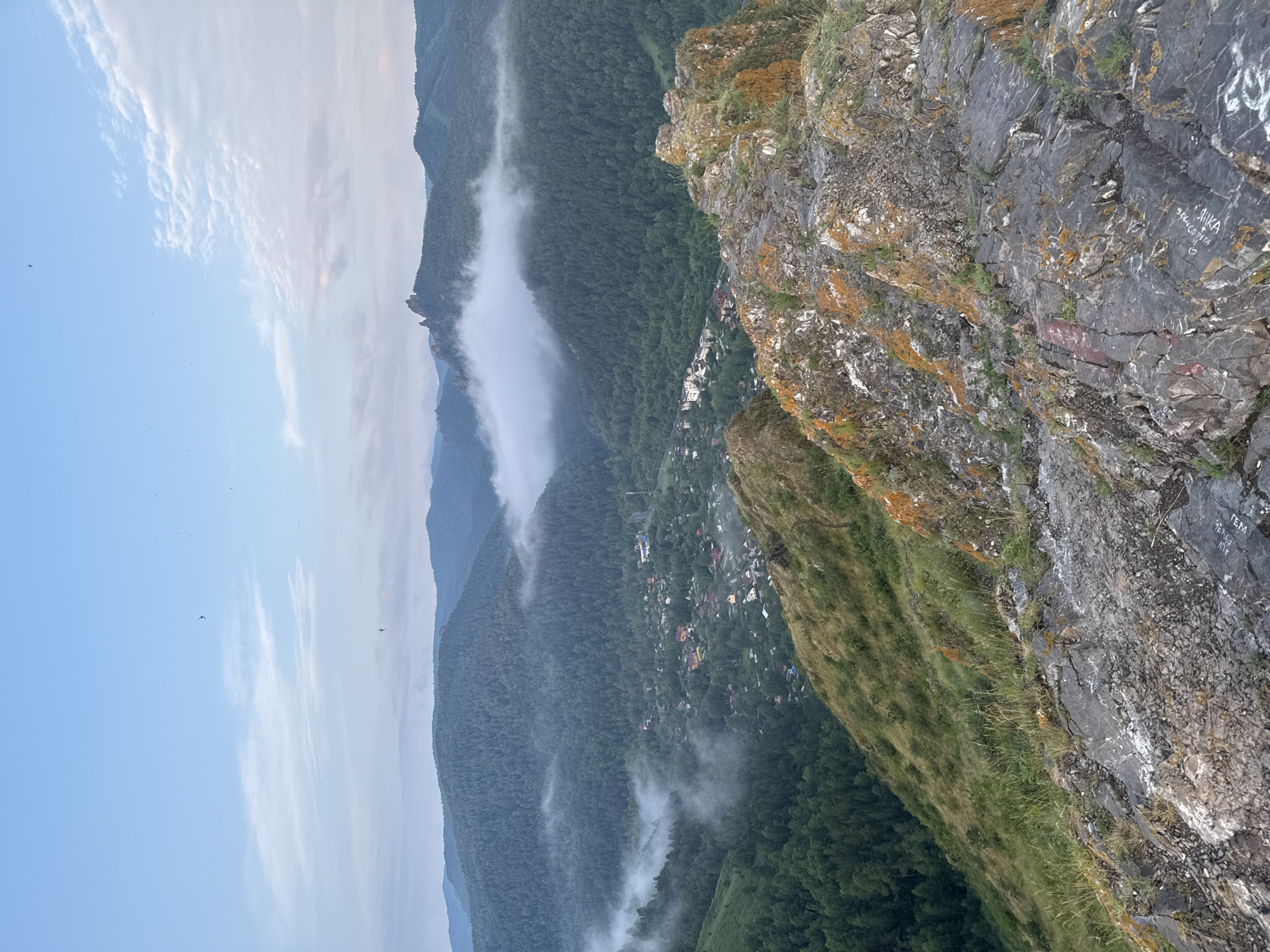 Krasnoyarsk blanketed in fog, seen from hilltops at sunset