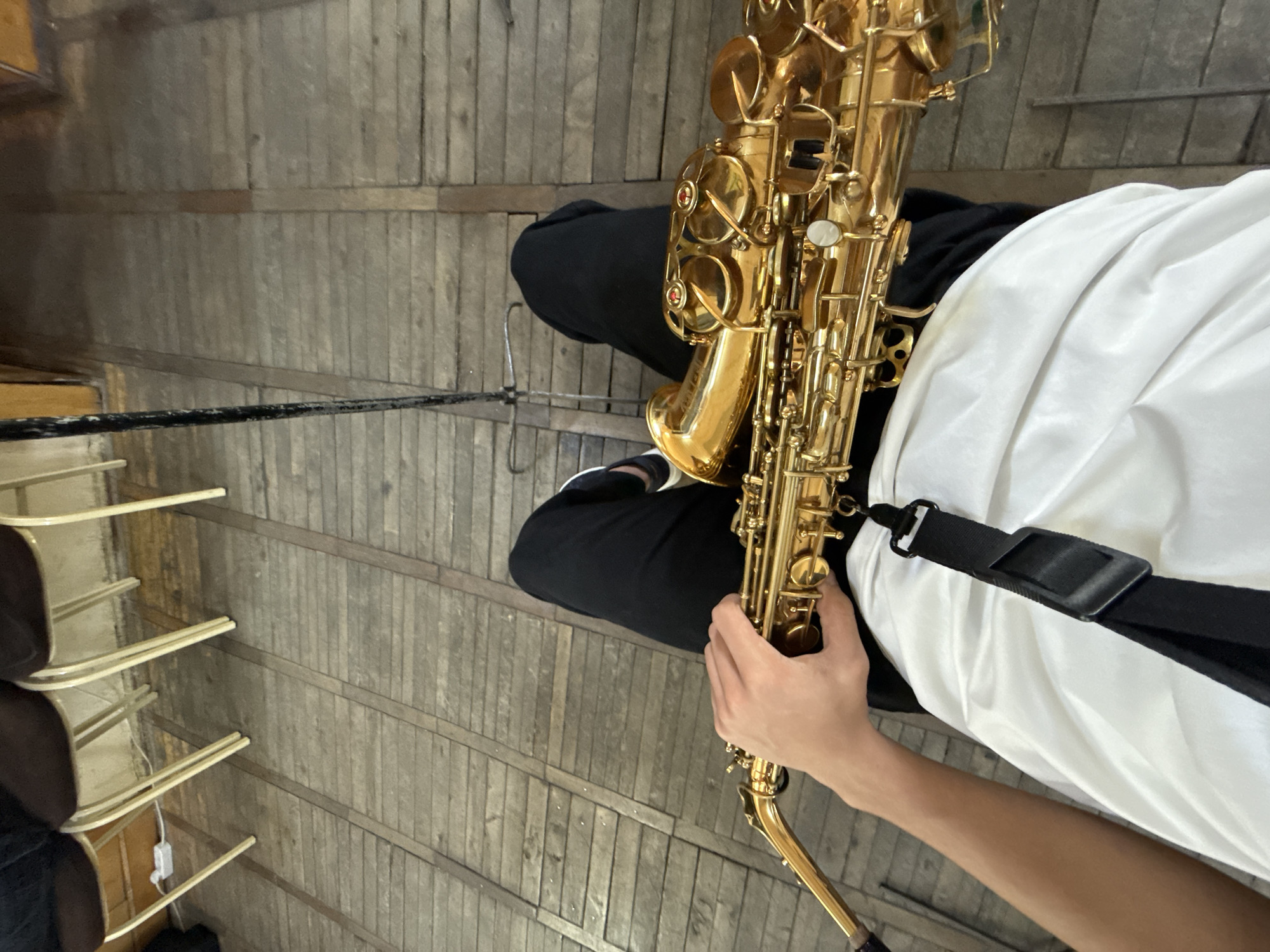 Musician with saxophone spotted in Yerevan indoor space