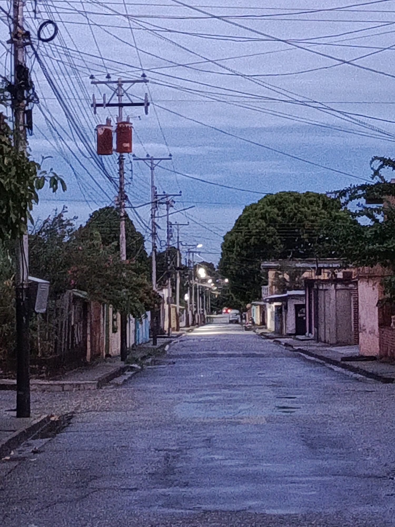Evening stroll documented in rain-dampened Tinaco, Venezuela