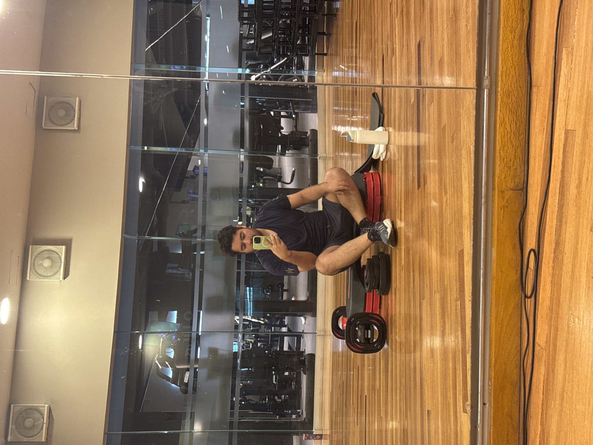 Young man takes selfie on gym floor in Puebla
