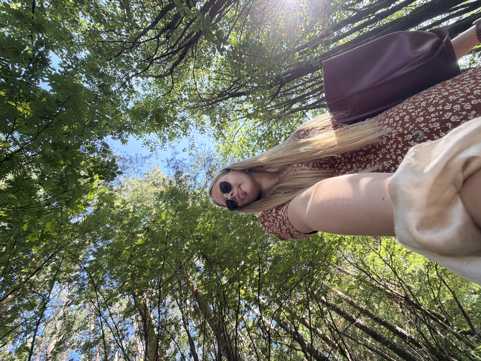 Outdoor selfie session in an Izhevsk forest, summer afternoon.