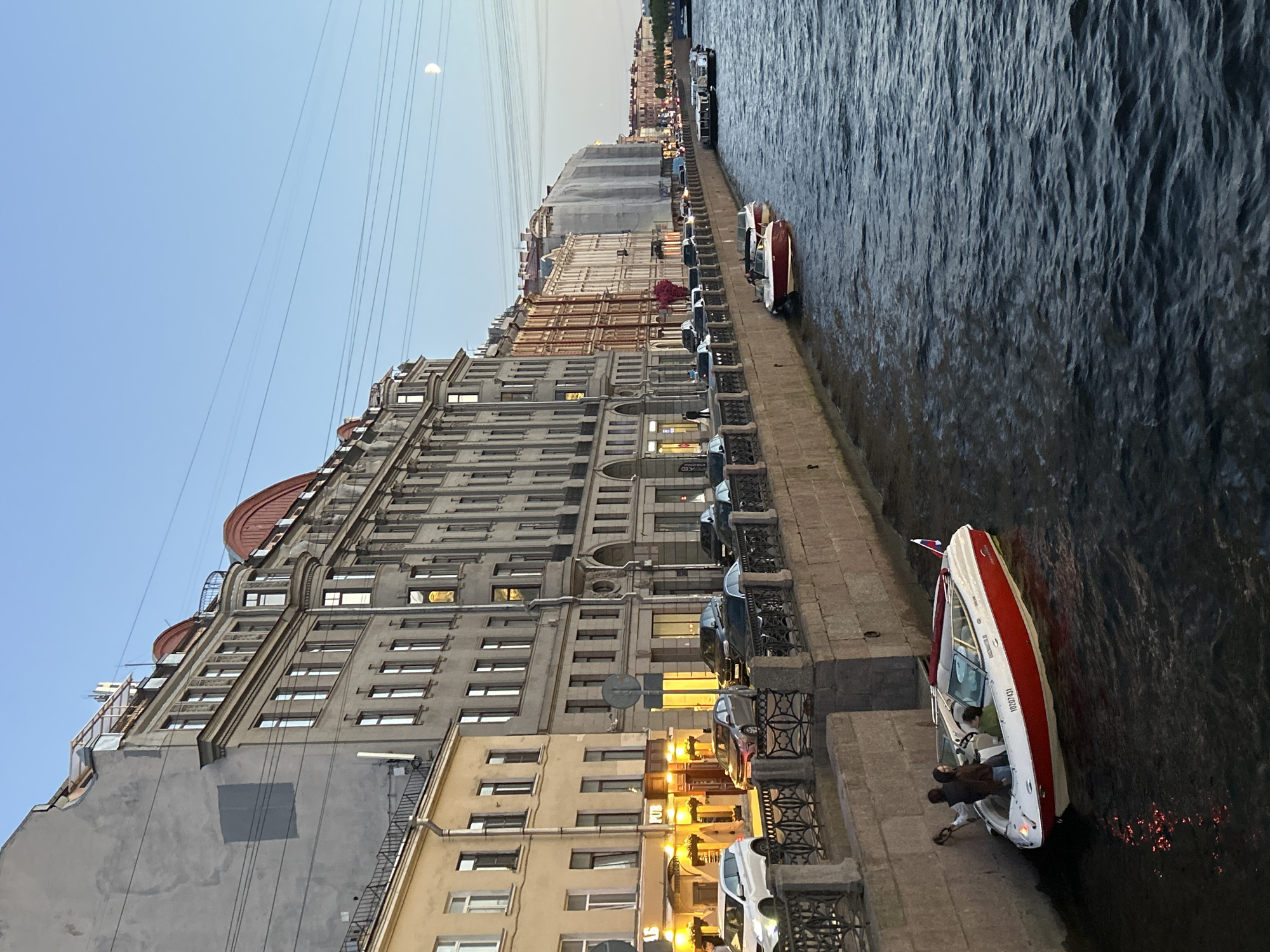 Dusk along a European canal city's waterfront streets
