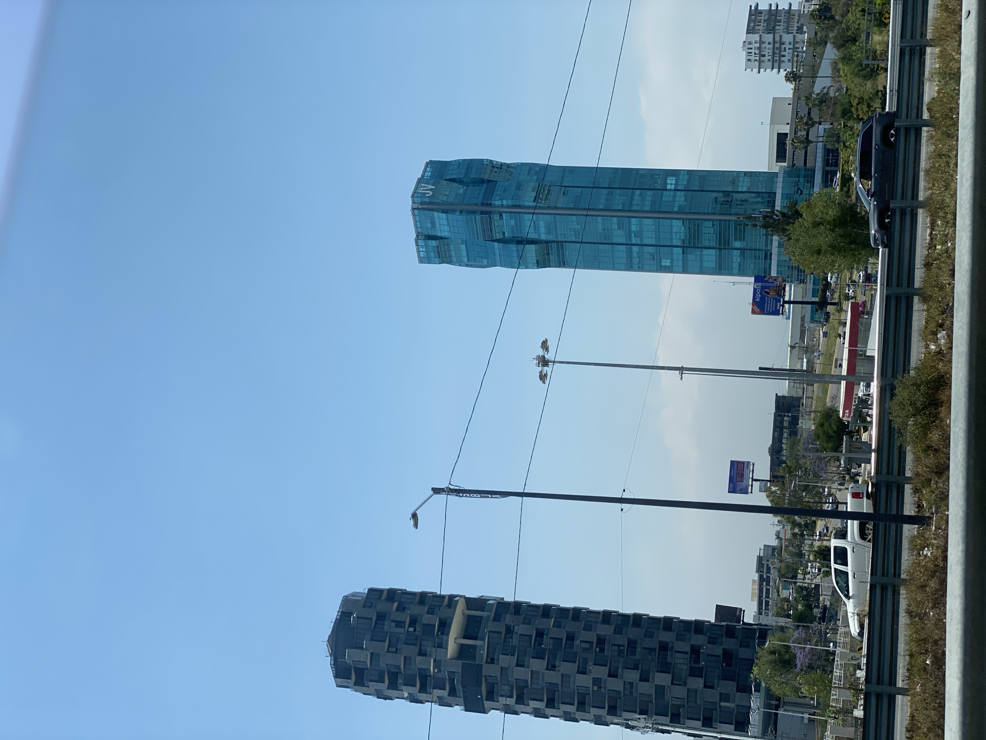 Urban buildings documented under clear blue sky