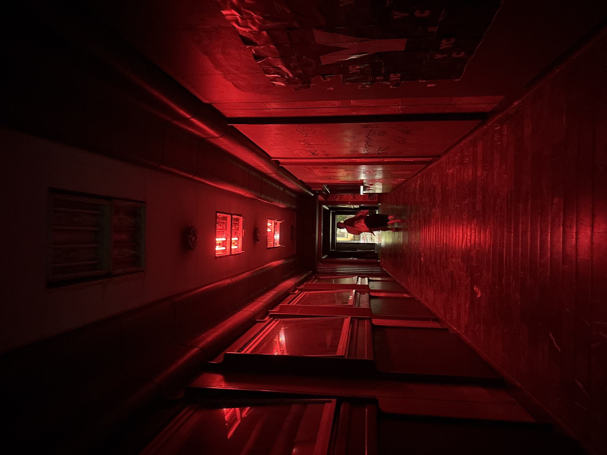 Red-lit hallways and open-air cinema on a Belgrade evening