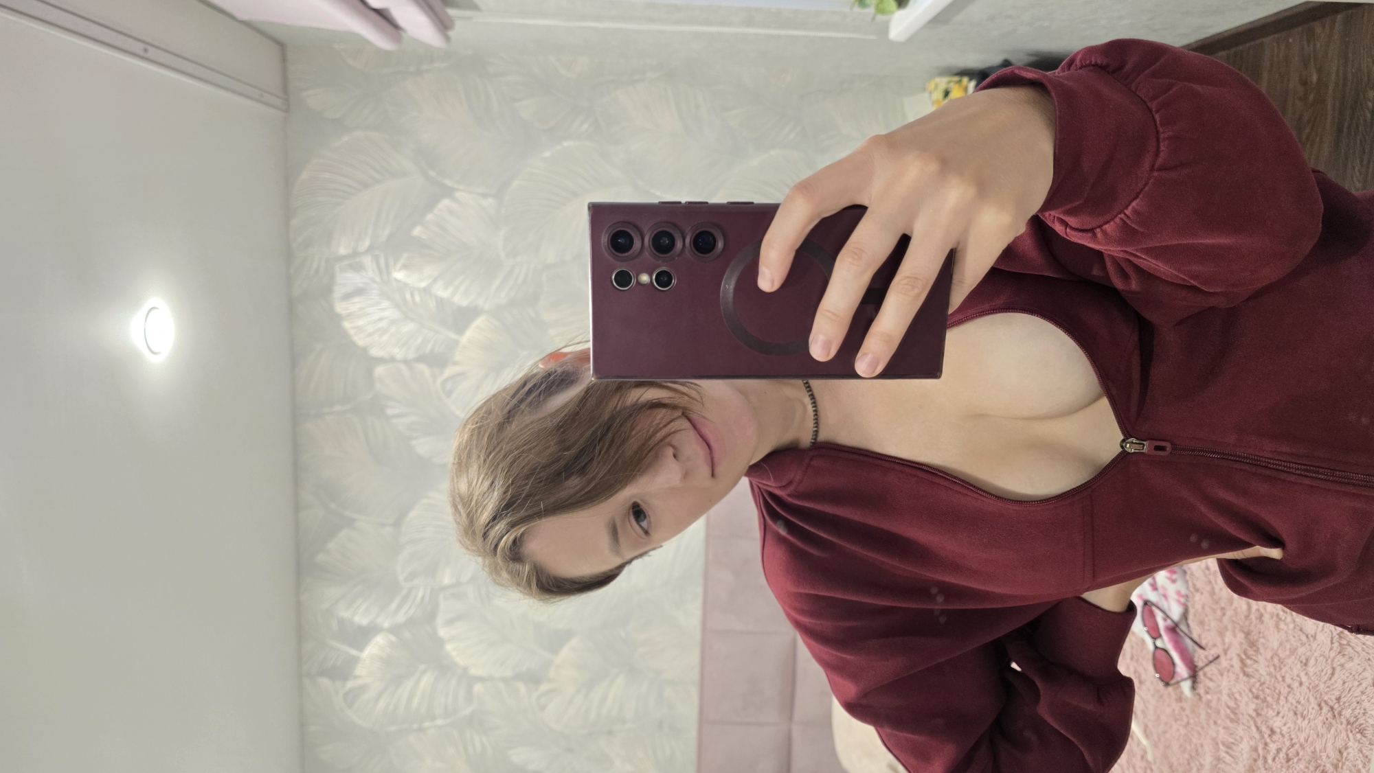 Bedroom snapshots: mirror selfie and a cat napping in Krasnoyarsk
