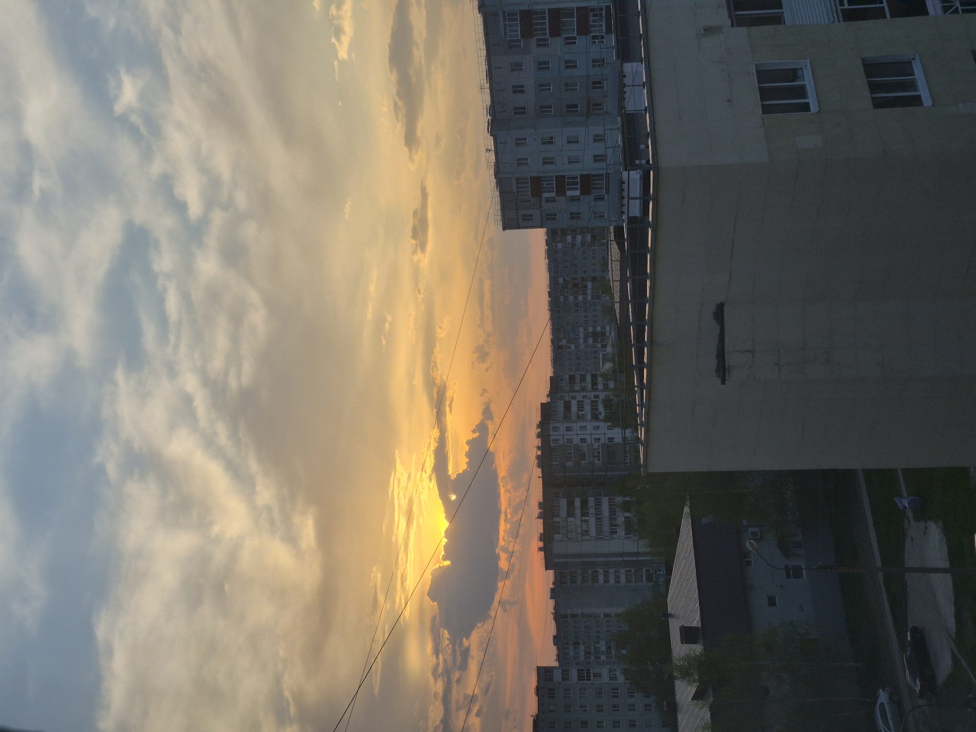 Mixed urban observations: sunset cityscape and Cyrillic whiteboard documented