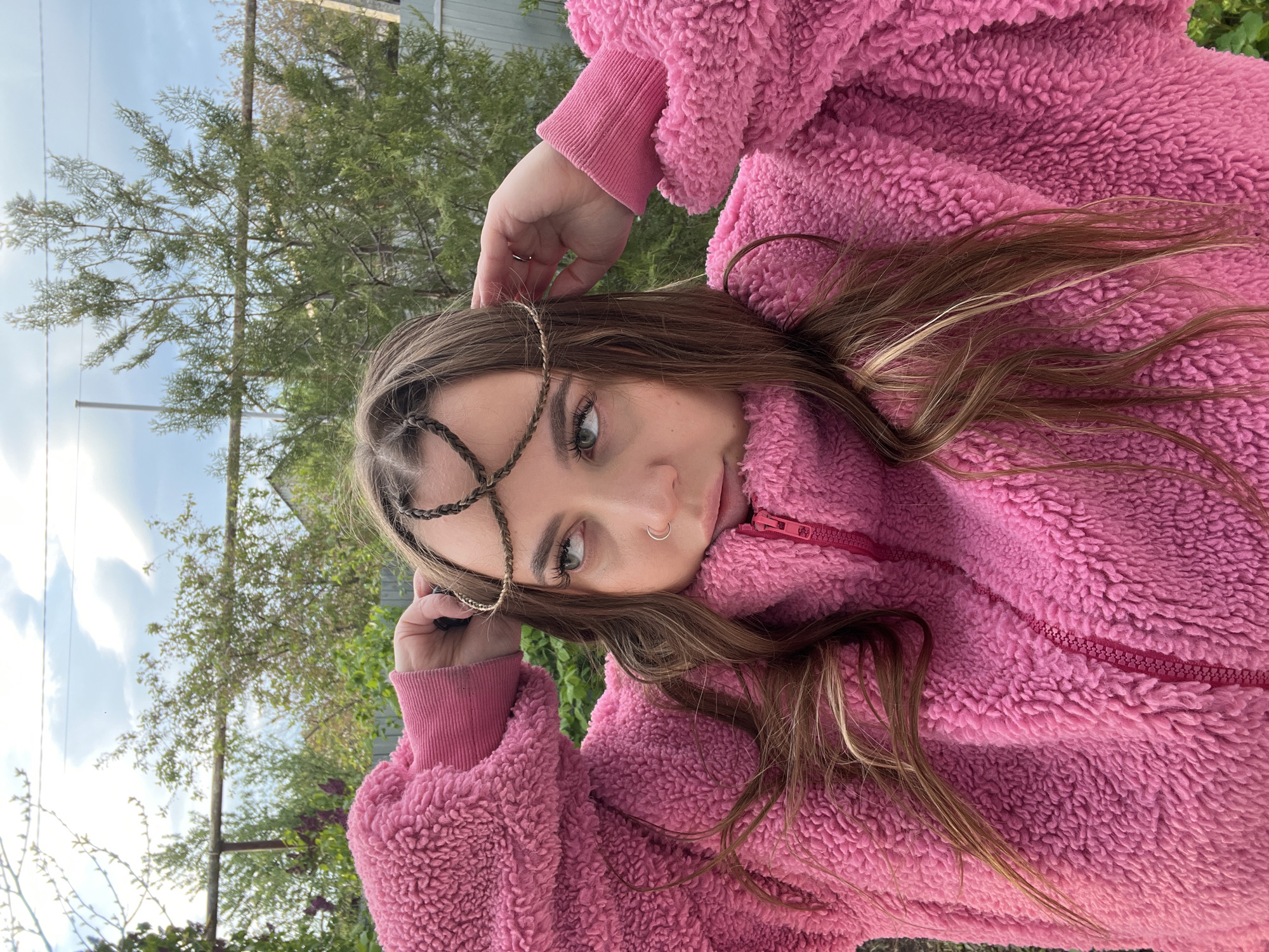 Woman photographs selfies indoors and outdoors in Novopokrovskaya