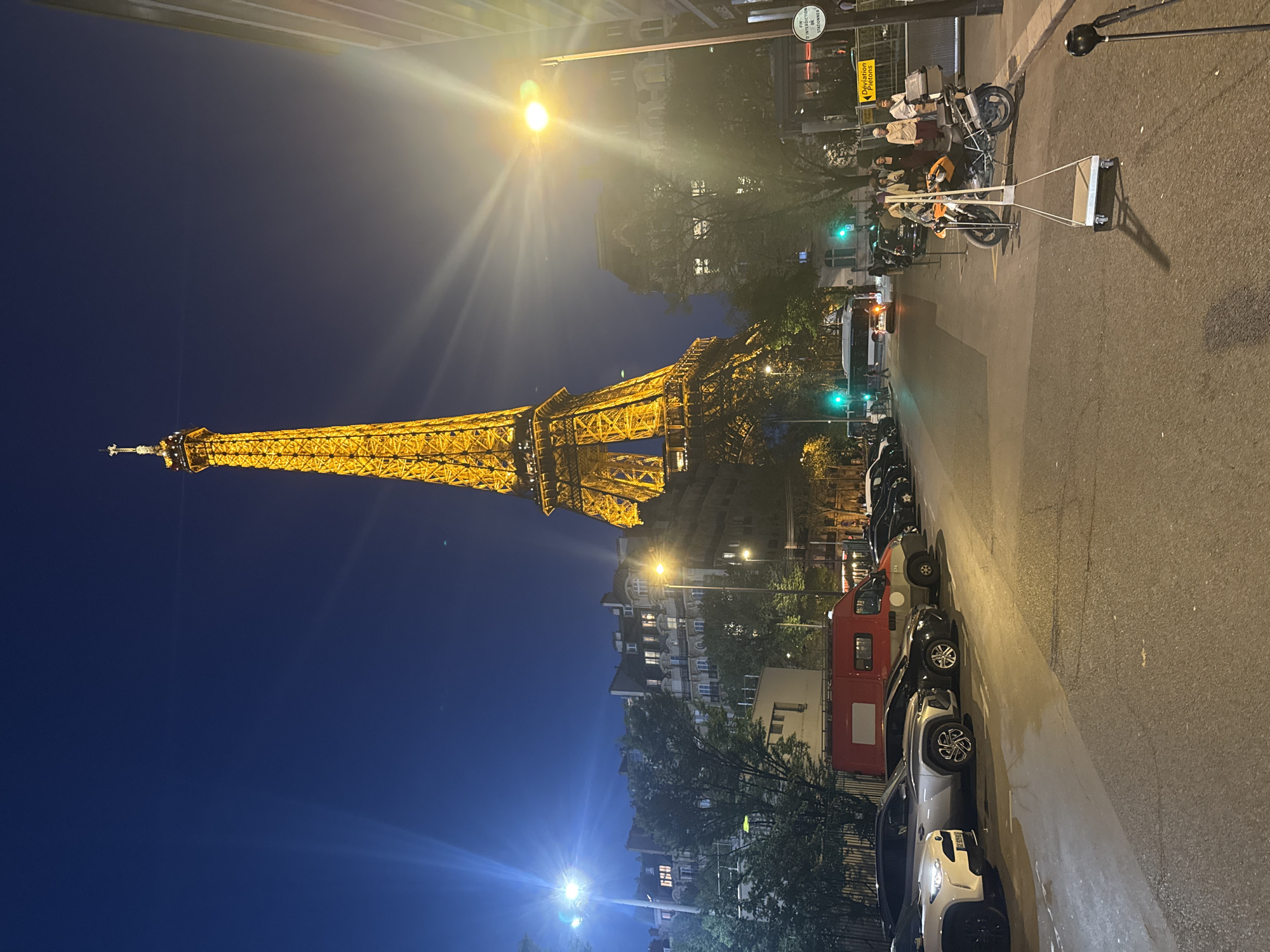 Eiffel Tower photographed illuminated against evening sky in Paris
