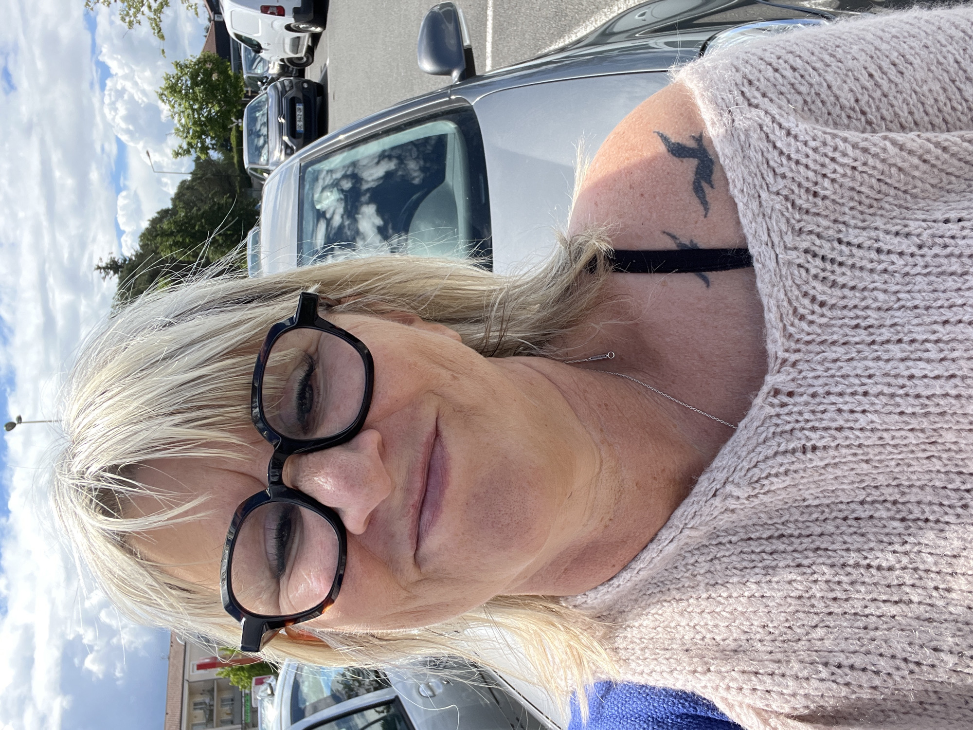 Woman visits flower nursery in Saint-Galmier, takes selfie