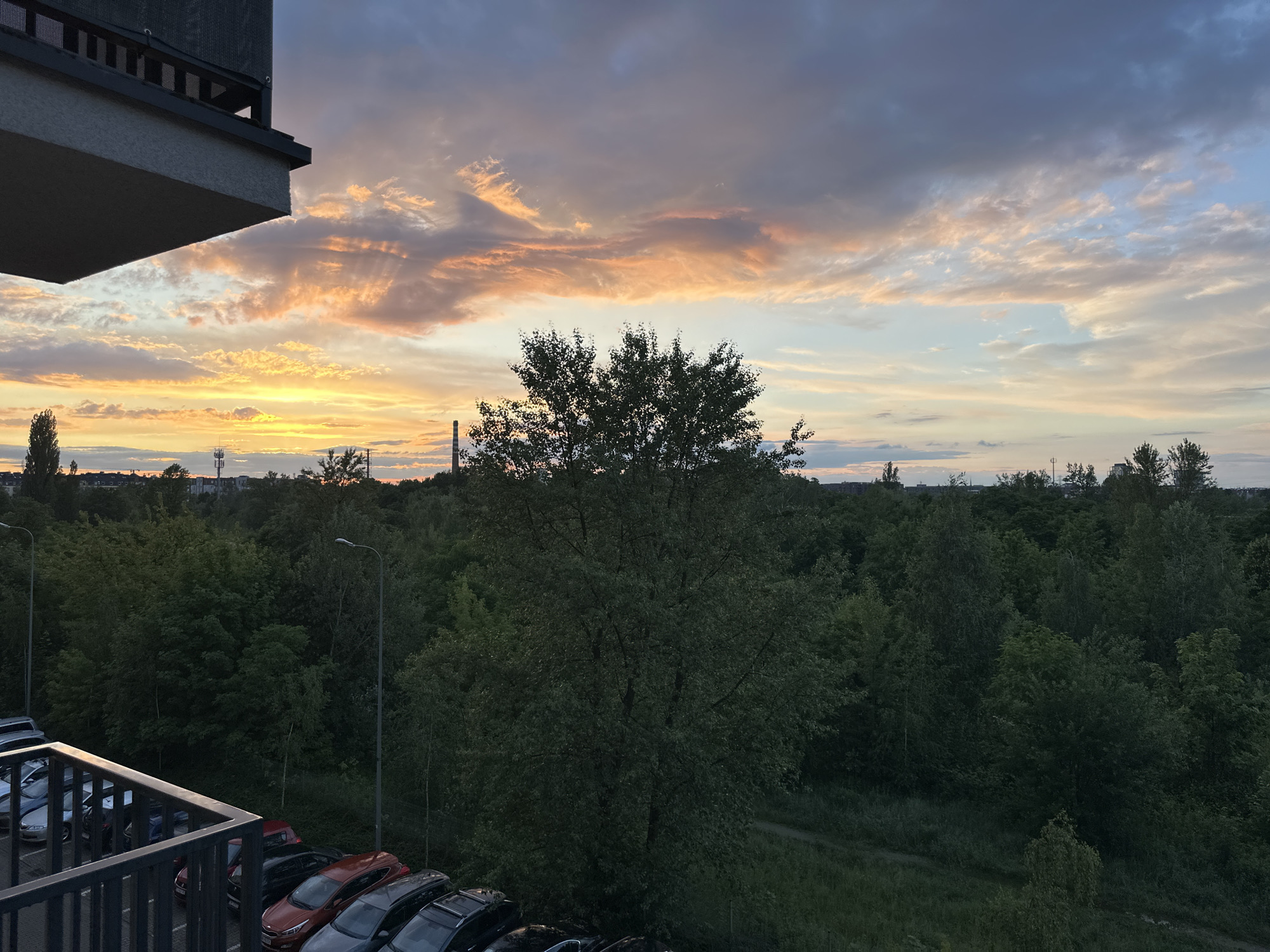 Twilight observations captured across Wrocław from elevated balcony position
