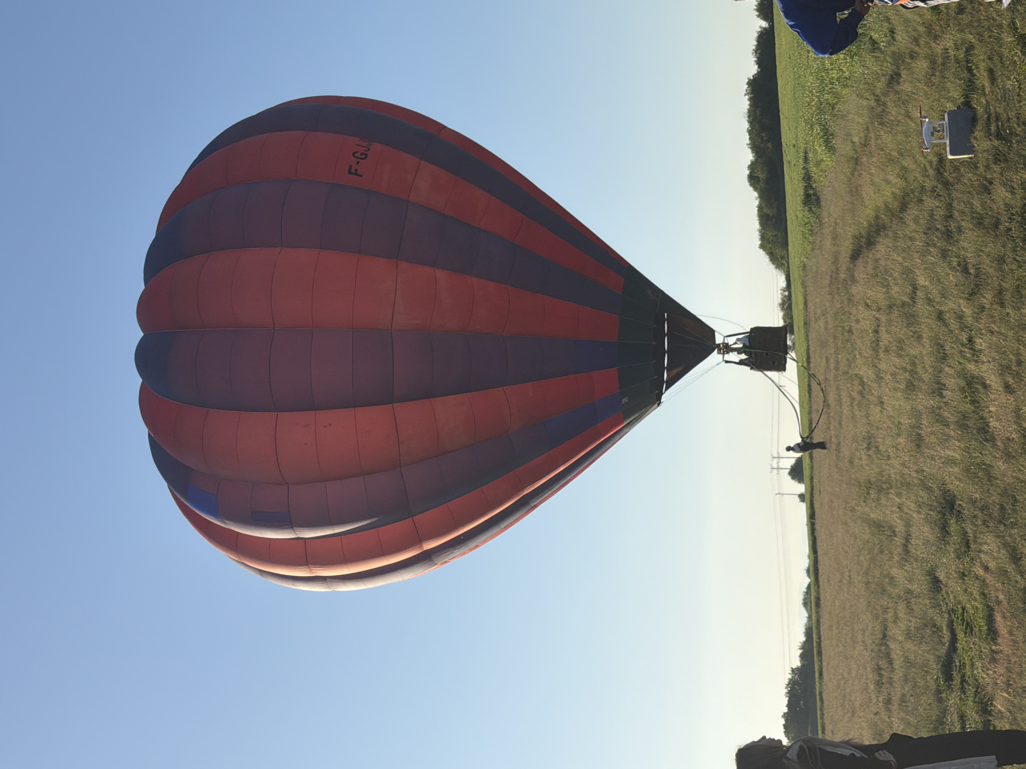 Hot air balloon rises over Bulgarian countryside