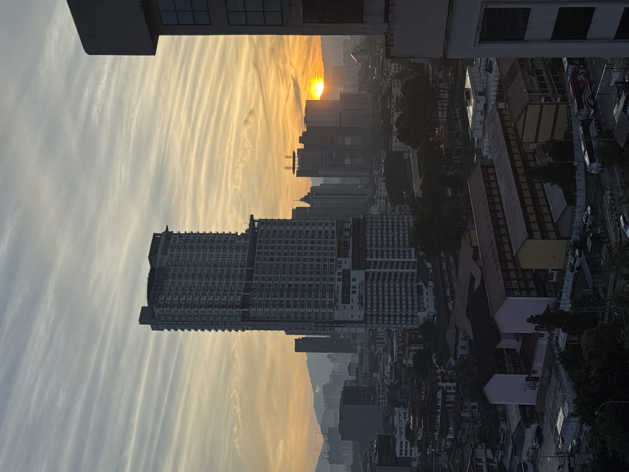KL skyline at dusk and night, viewed from a high-rise room